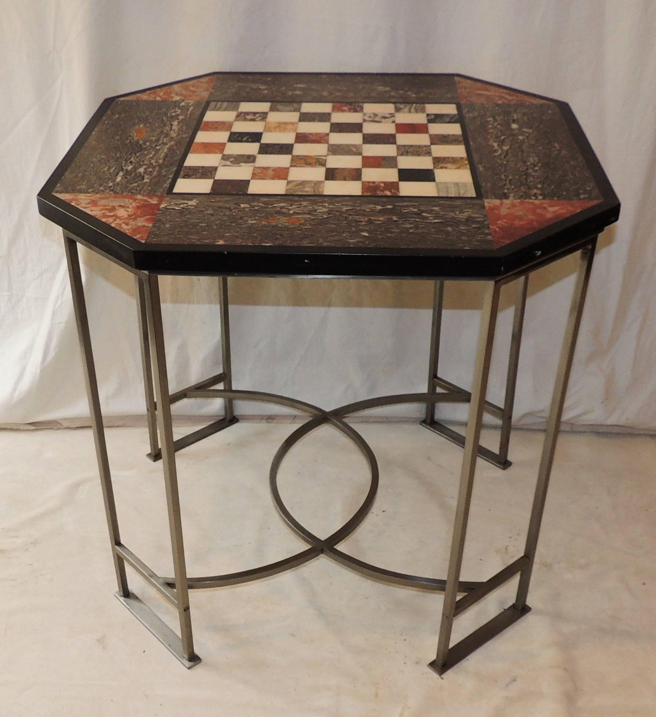 Beautiful multiple types of marble inlays decorate the top of this unusual game table with circular decorative legs.

Measures: 27.5" L x 27.5" W x 26.5" H.