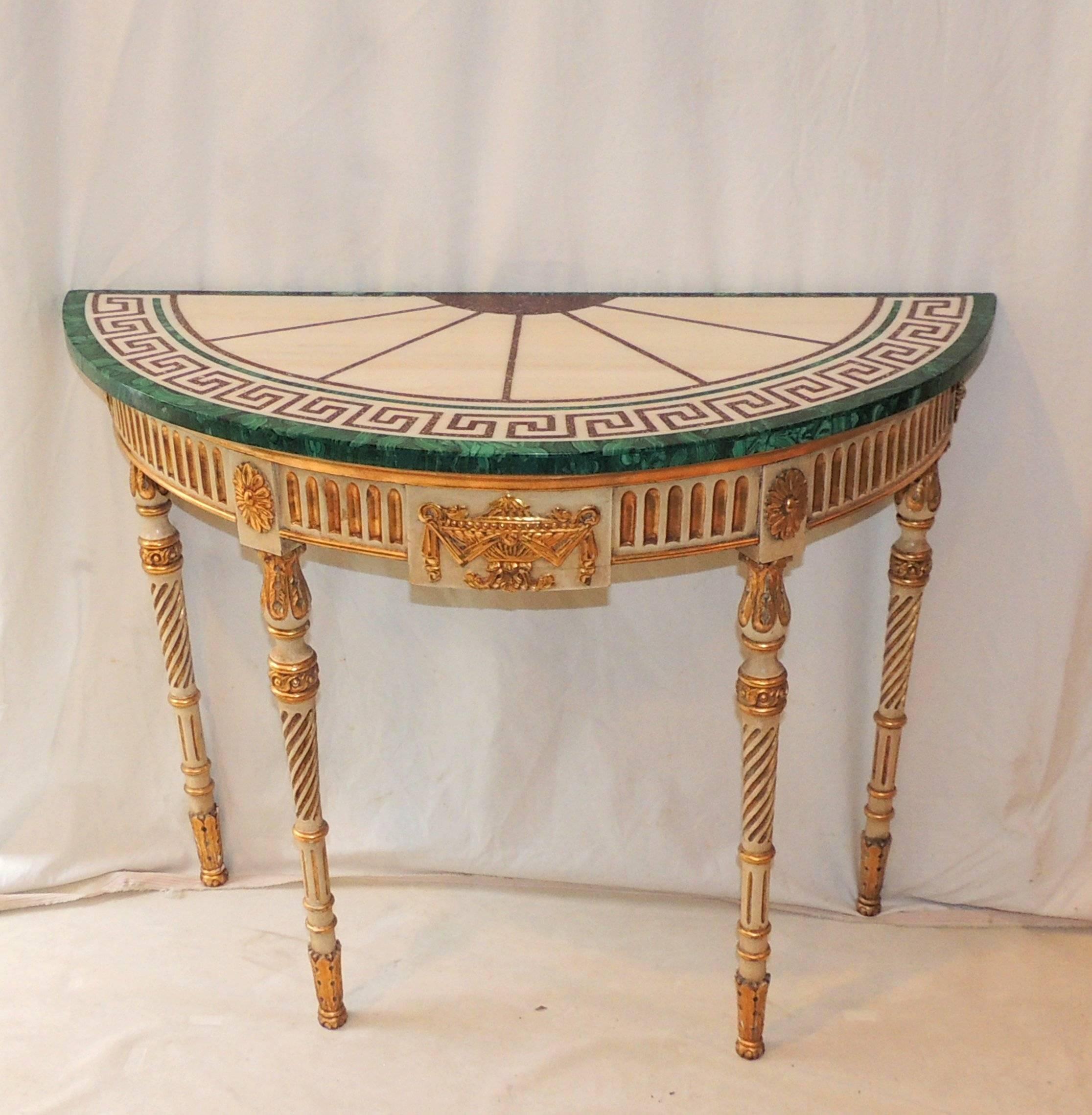 Wonderful giltwood console with marble and malachite with Greek Key design.
The giltwood table is carved with gilt centre urn and beautifully decorated carved legs.

Measures: 28