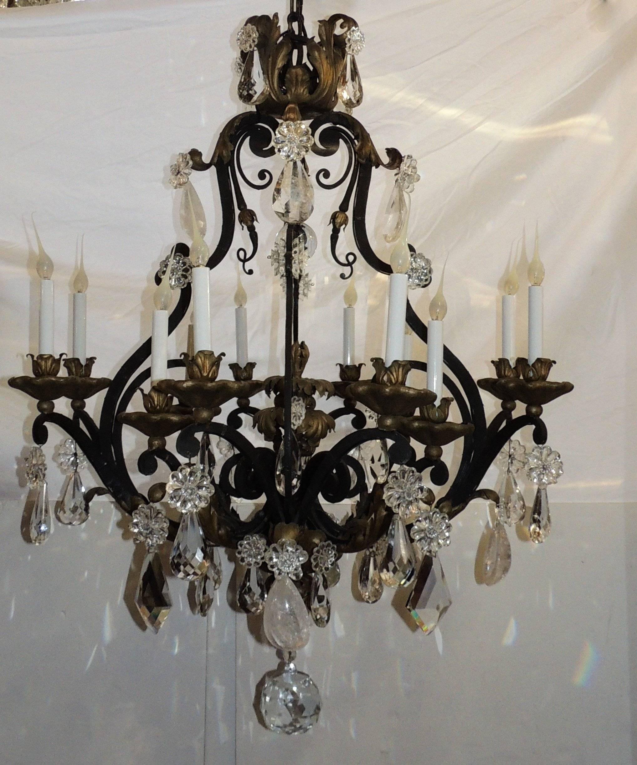 Wonderful large French wrought iron gilt bagues rock crystal twelve-light chandelier.

Measures: 46