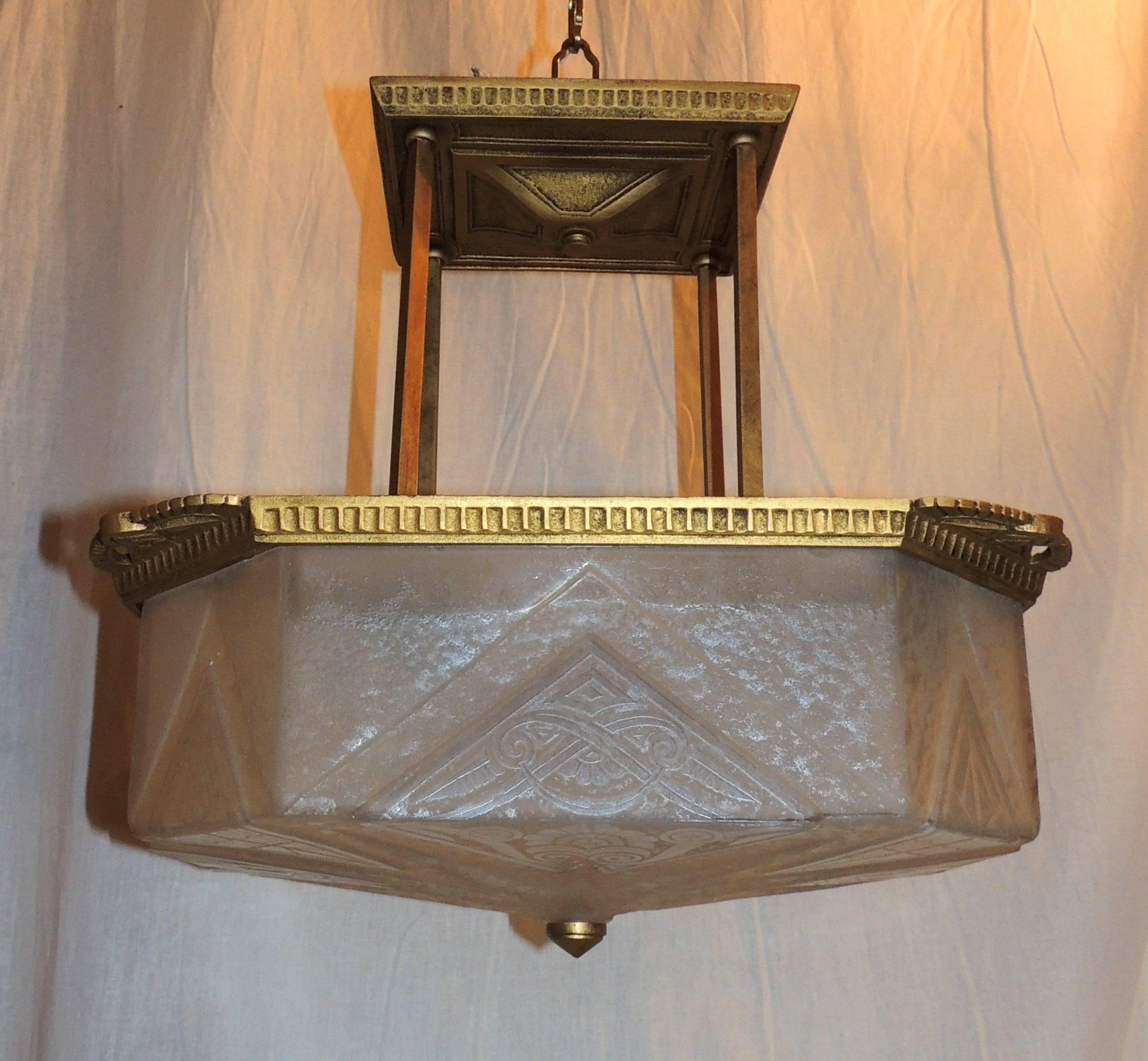 Wonderful Art Deco Lightolier bronze frosted glass pendent chandelier fixture rewired with four light inside.


Measures: 16" W x 13" D x 16" H.