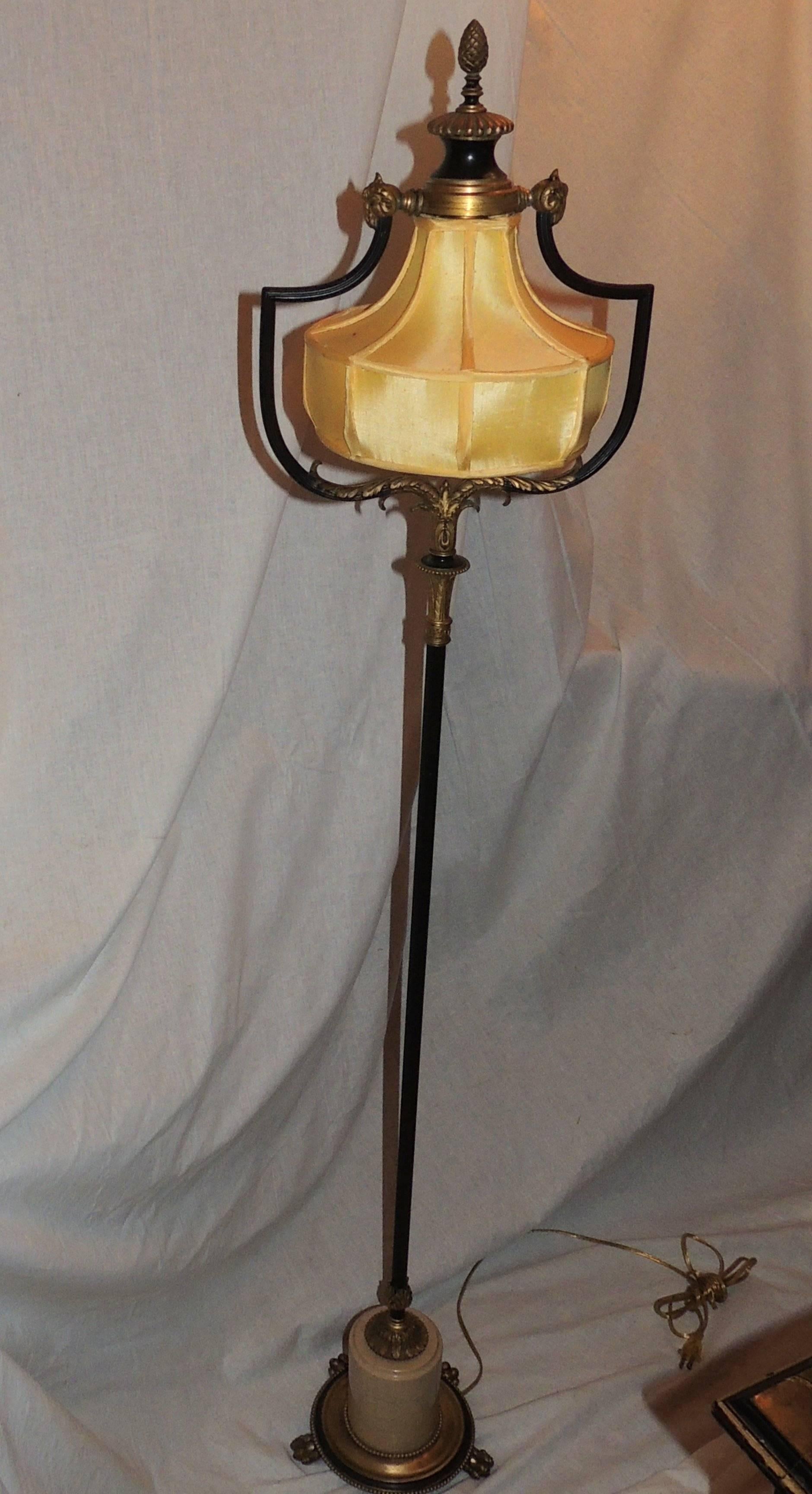 A wonderful neoclassical patinated gilt bronze Caldwell floor lamp silk shade set with marble and finished with bronze claw feet
Rewired and ready to enjoy.

Measures: 12" W x 58" H.