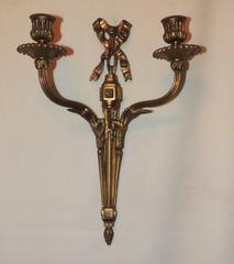 Wonderful French Gilt Bronze Set of Four Bow Top Neoclassical Two-Arm Sconces