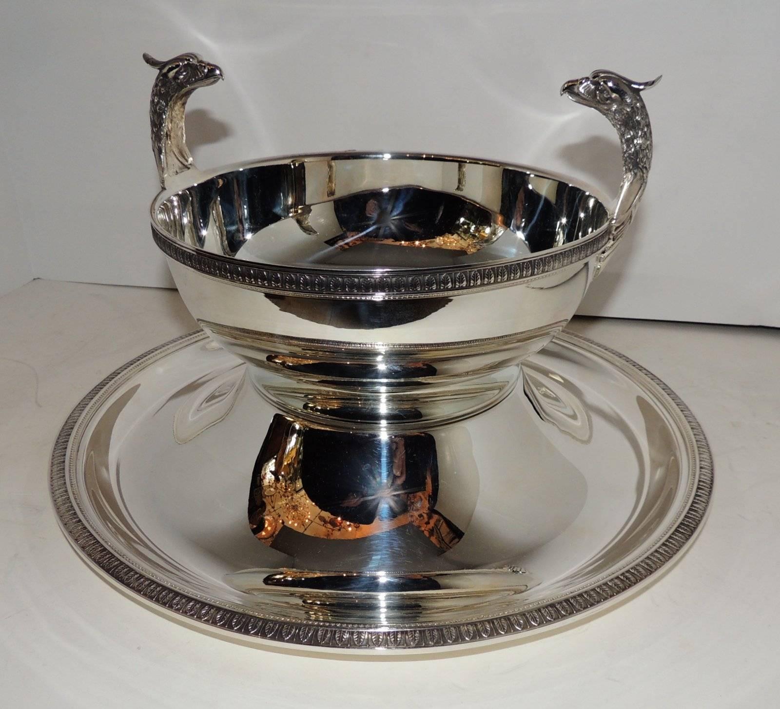 A rare and wonderful Christofle Malmaison two-piece pedestal silver plate centerpiece. The pattern Malmaison is in the Regency Empire style, with it's frieze of delicate palm and lotus leaves and symmetrical design finished with swan handle