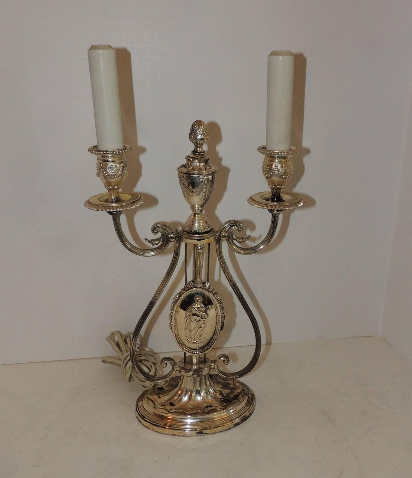 A wonderful Caldwell silvered bronze candelabra lamp.


The height to the top of candle cup Is 13