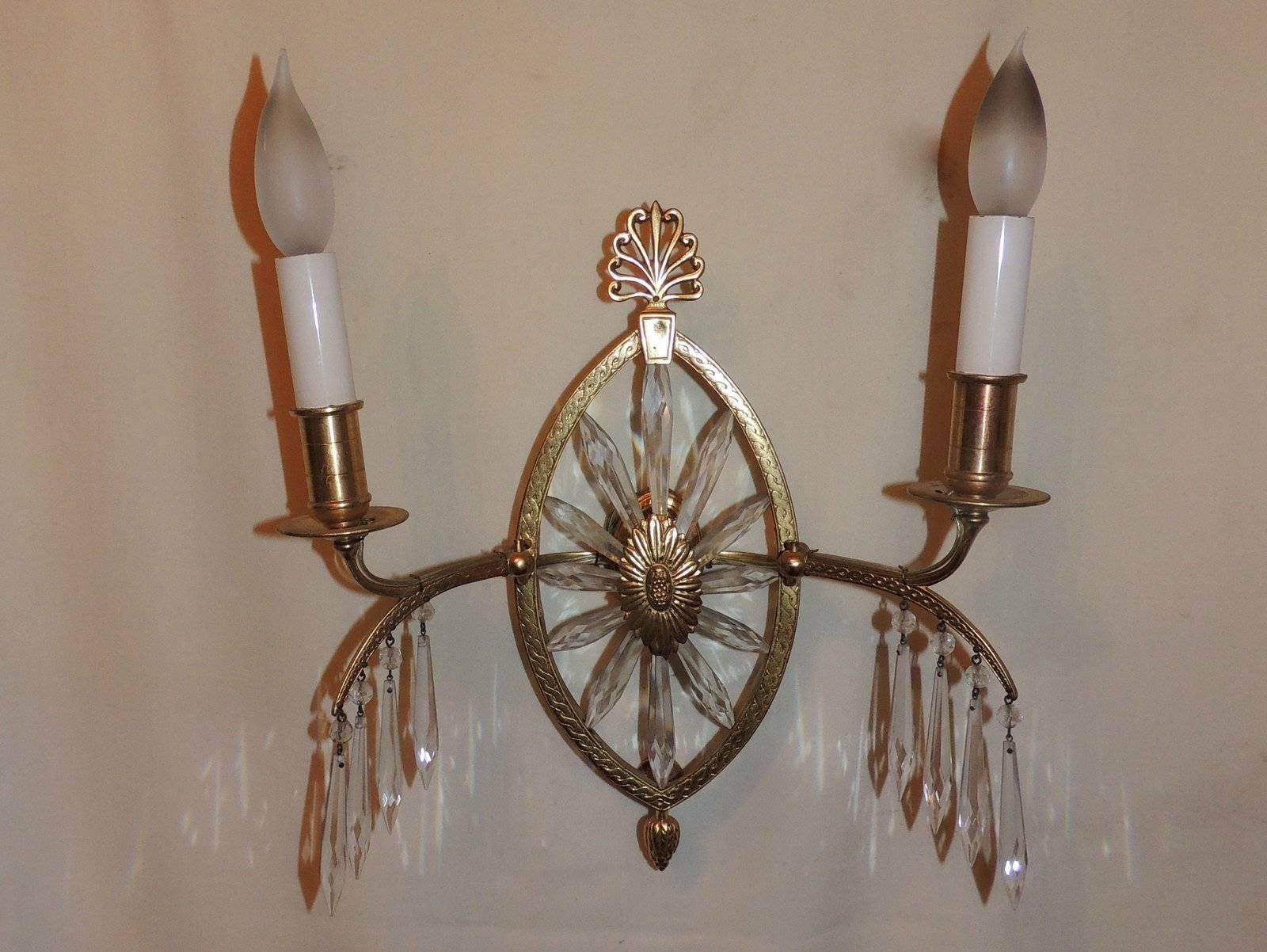 A wonderful neoclassical French bronze and crystal set of Six sconces in the manner of Caldwell with two arms that are adjustable and a center starburst with crystal spears.

Rewired and ready to install

Three pairs available, sold