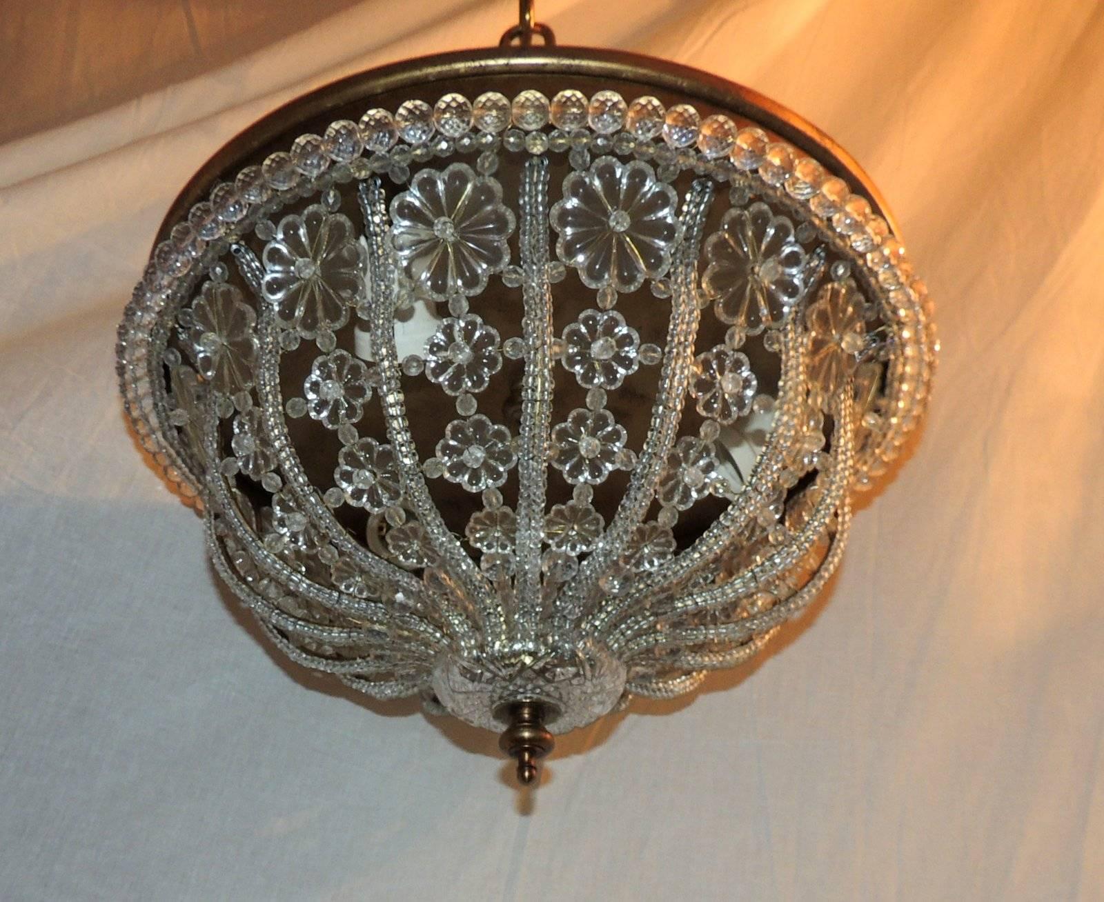 Wonderful crystal and bronze flush mount with crystal beaded trim and ascending crystal flowers. Has three Edison interior lights 75 watts each.

Pair Available
Sold Desperately
 
Measures: 15" W x 8" H.