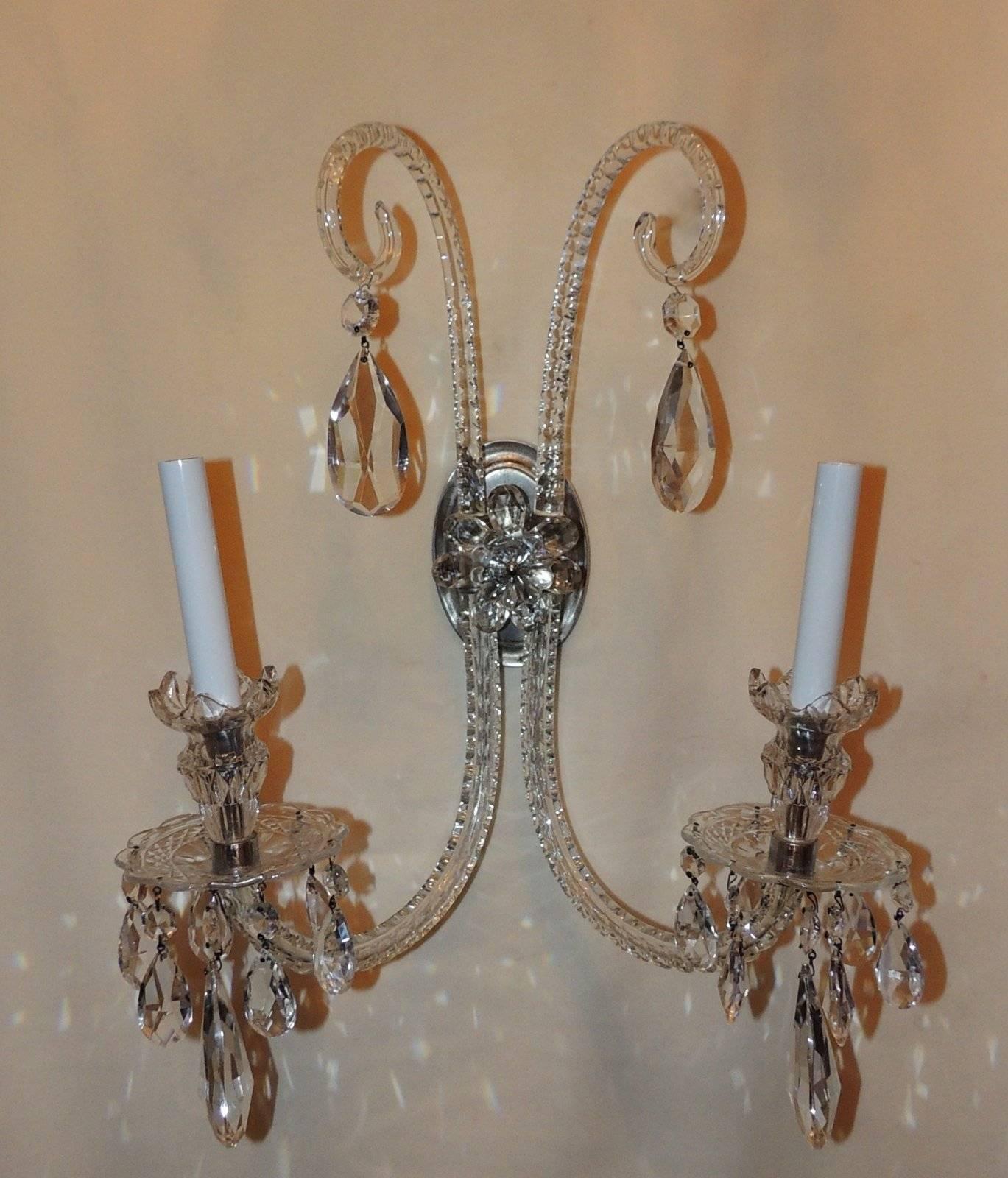 An elegant pair of Georgian style English sconces with beautiful cut crystal and faceted arms and prism drops and a silvered bronze center medallion and finished with a large cut crystal flower. 
Completely Redone, Ready to Install

Measures: 21