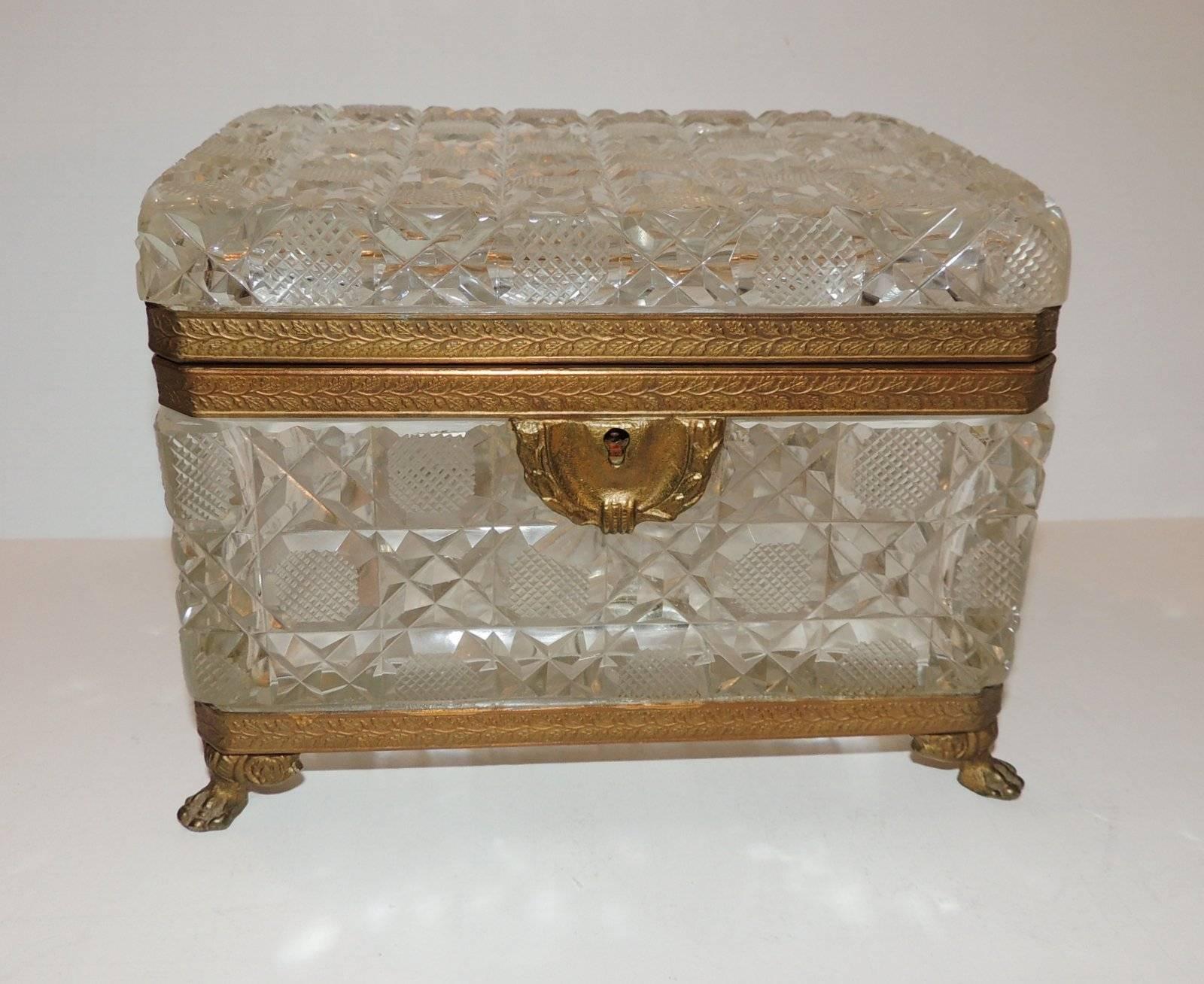 A lovely French faceted etched cut crystal casket with engraved bronze ormolu footed mounts. 

Measures: 7