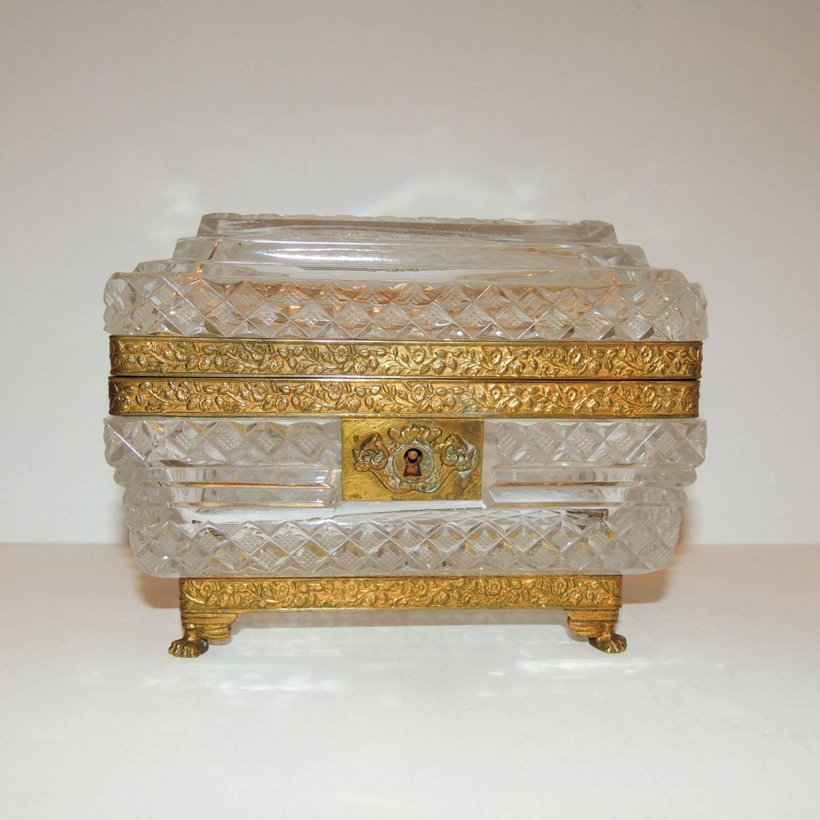 Wonderful pair of French faceted cut crystal bronze ormolu-mounted casket jewelry box with scroll engraving, draped wreath keyhole and footed corners and key.

Measures: 6" W x 3.5" D x 5" H

Price per item.