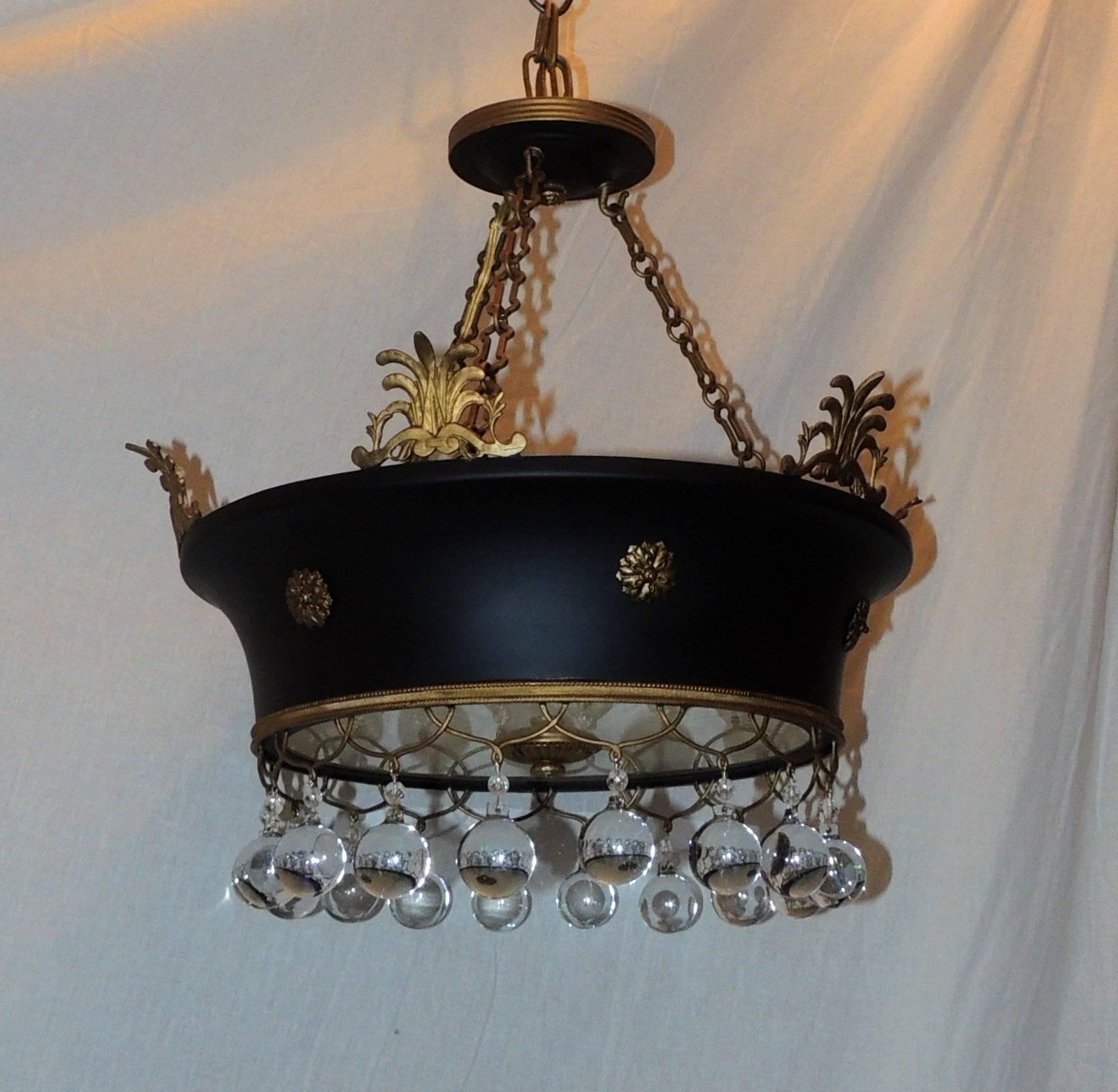 A Wonderful French Empire doré bronze and patina ormolu tole basket fixture with frosted etched glass centre and decorated with crystal ball drops.
Set with four candelabra sockets that can accommodate up to 40 watts each.
Completely redone and