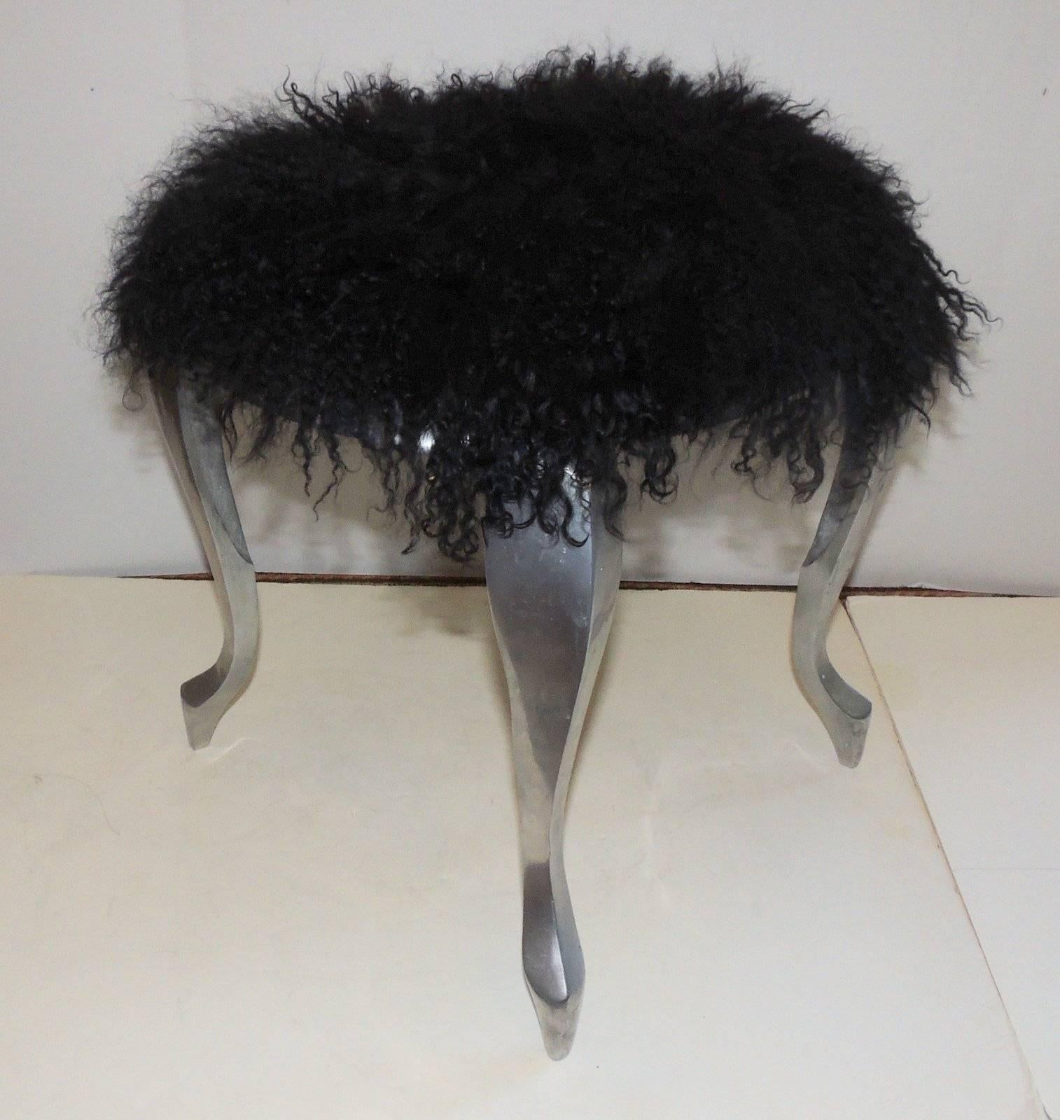 A wonderful Mid-Century Modern pair of steel, shag black faux lambs fur footstools / benches. Great for any space. 

Measures: 14" W x 12" D x 16" H.