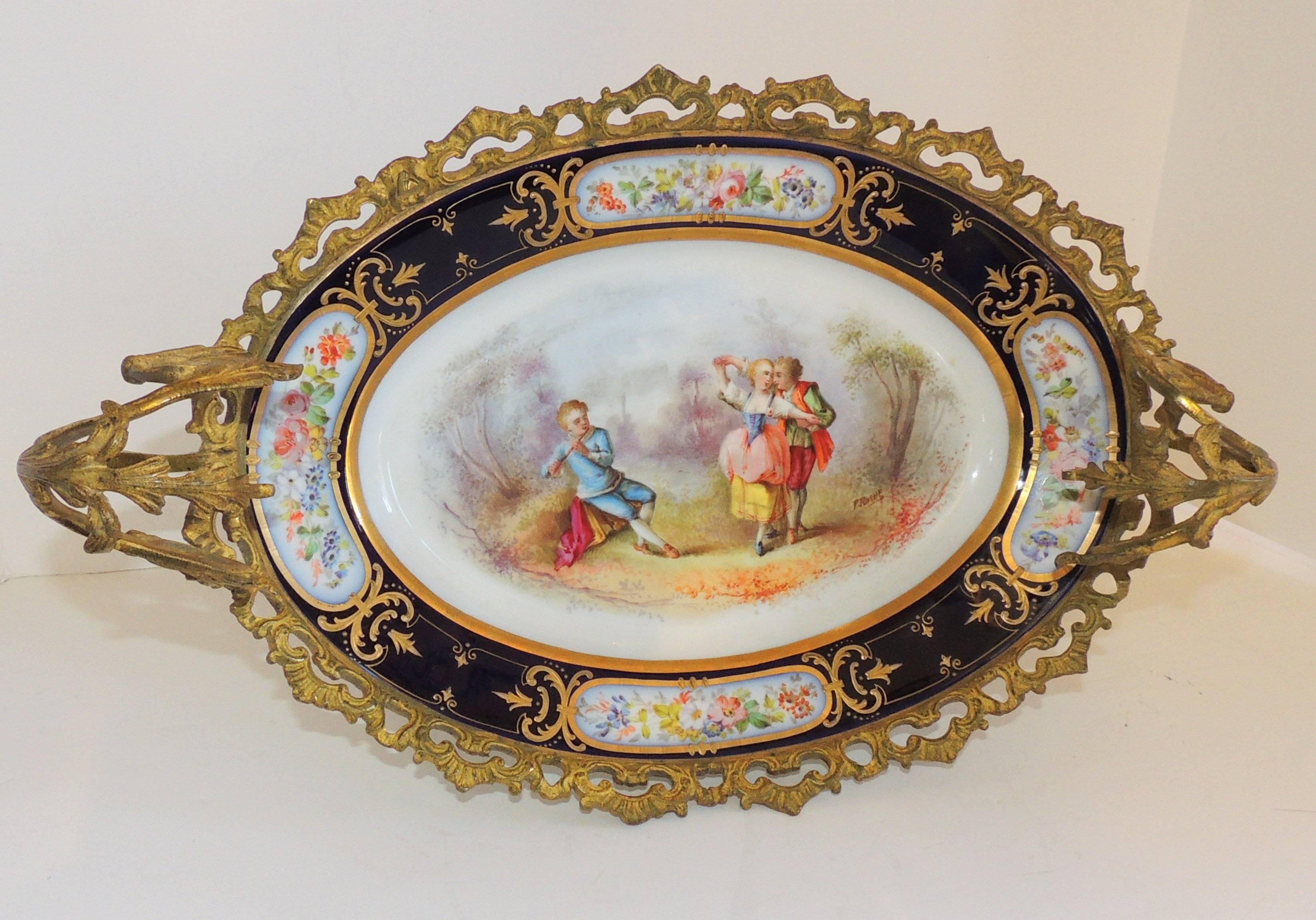 Wonderful French Ormolu bronze sevres hand-painted porcelain centerpiece tray.

Measures: 17.5