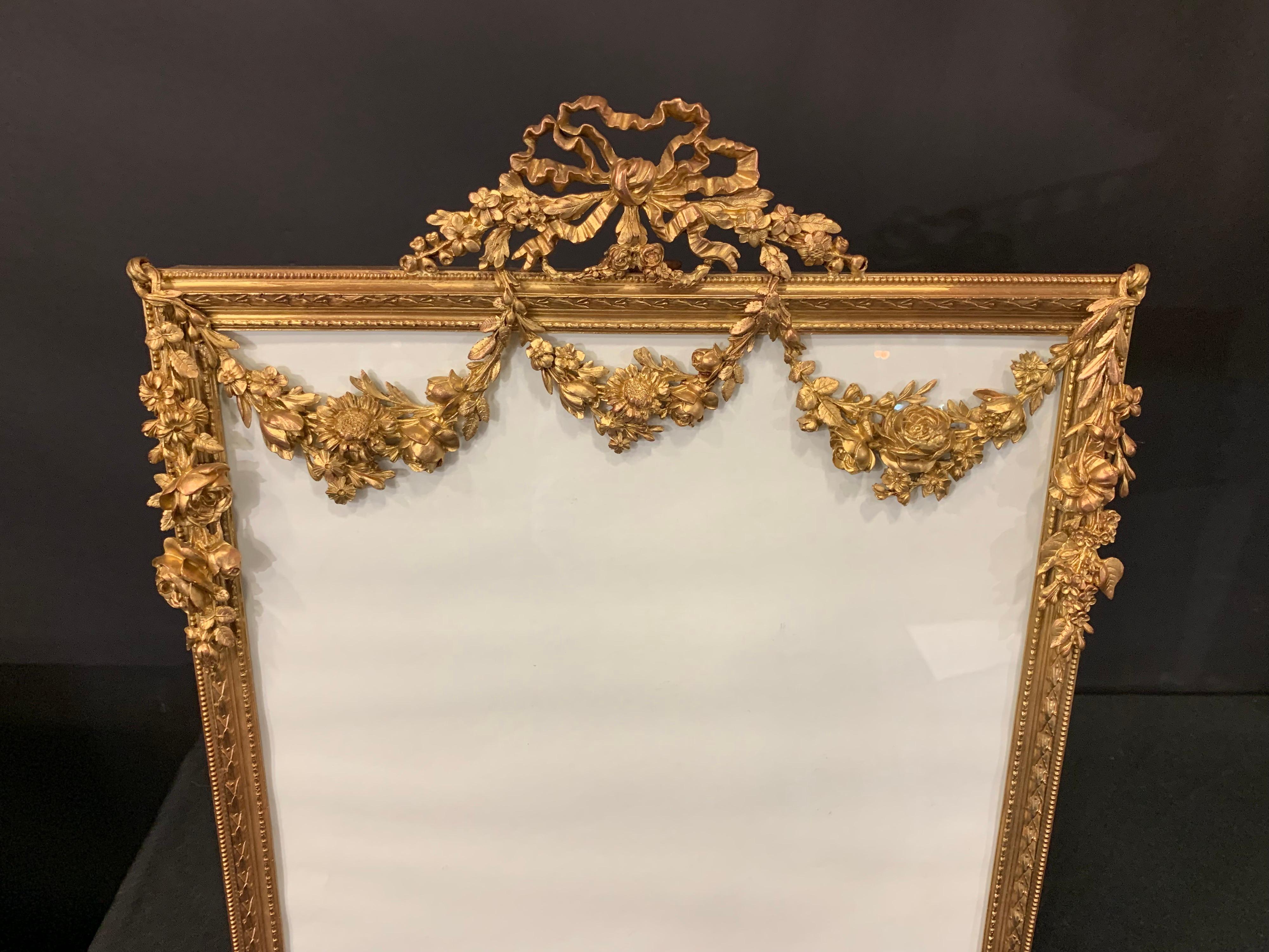 A wonderful French large bronze ormolu-mounted bow top garland swag picture frame with bronze easel back
Measures: 17