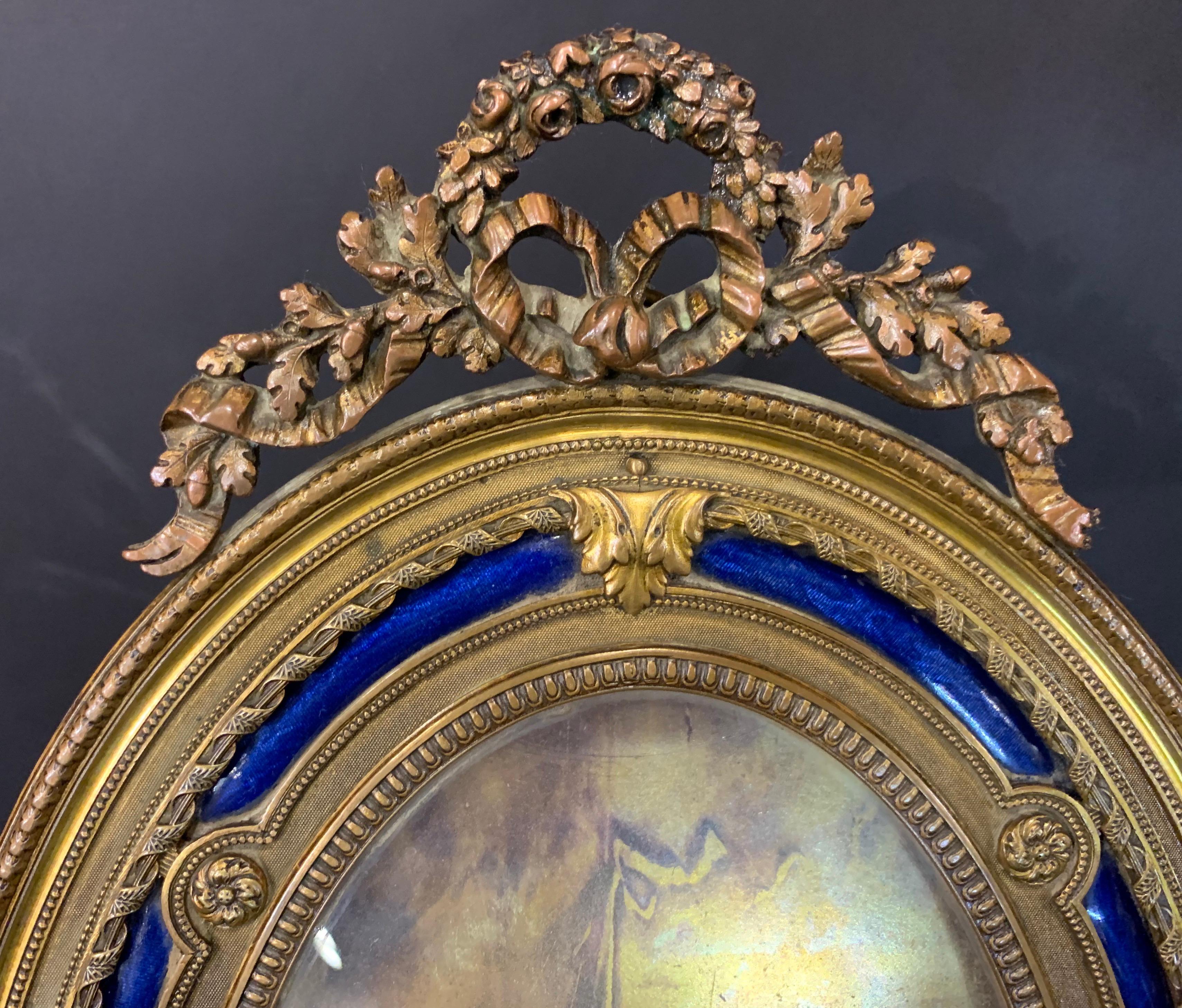 Wonderful French Gilt Bronze Blue Enamel Oval Bow Top Picture Frame In Good Condition In Roslyn, NY