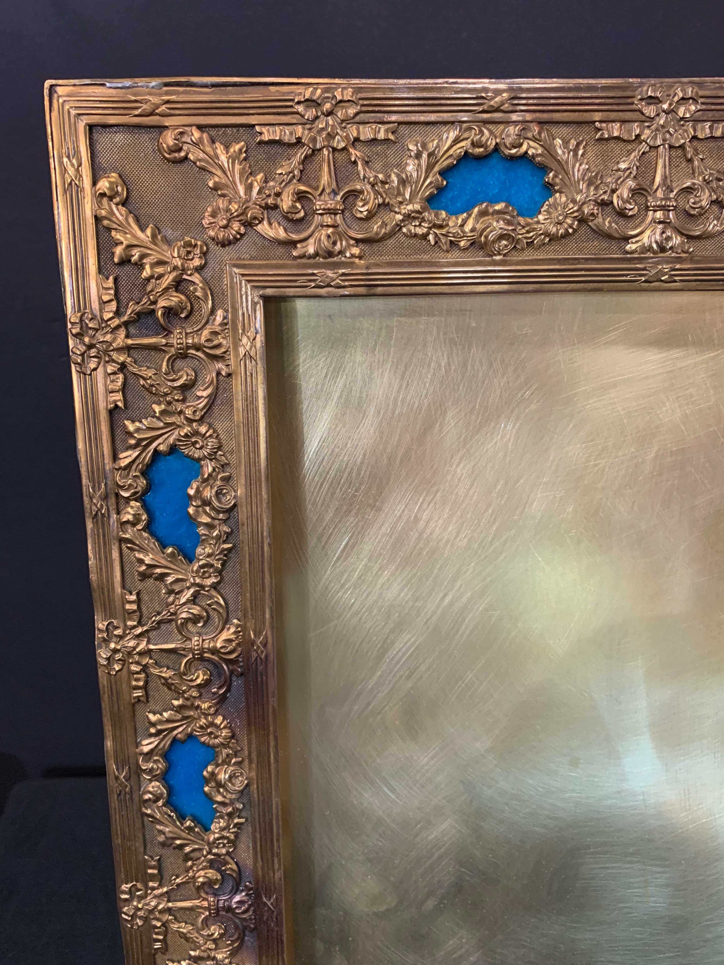 A wonderful french large blue enamel inset and bronze picture frame with bows and swags.
Measures: 18