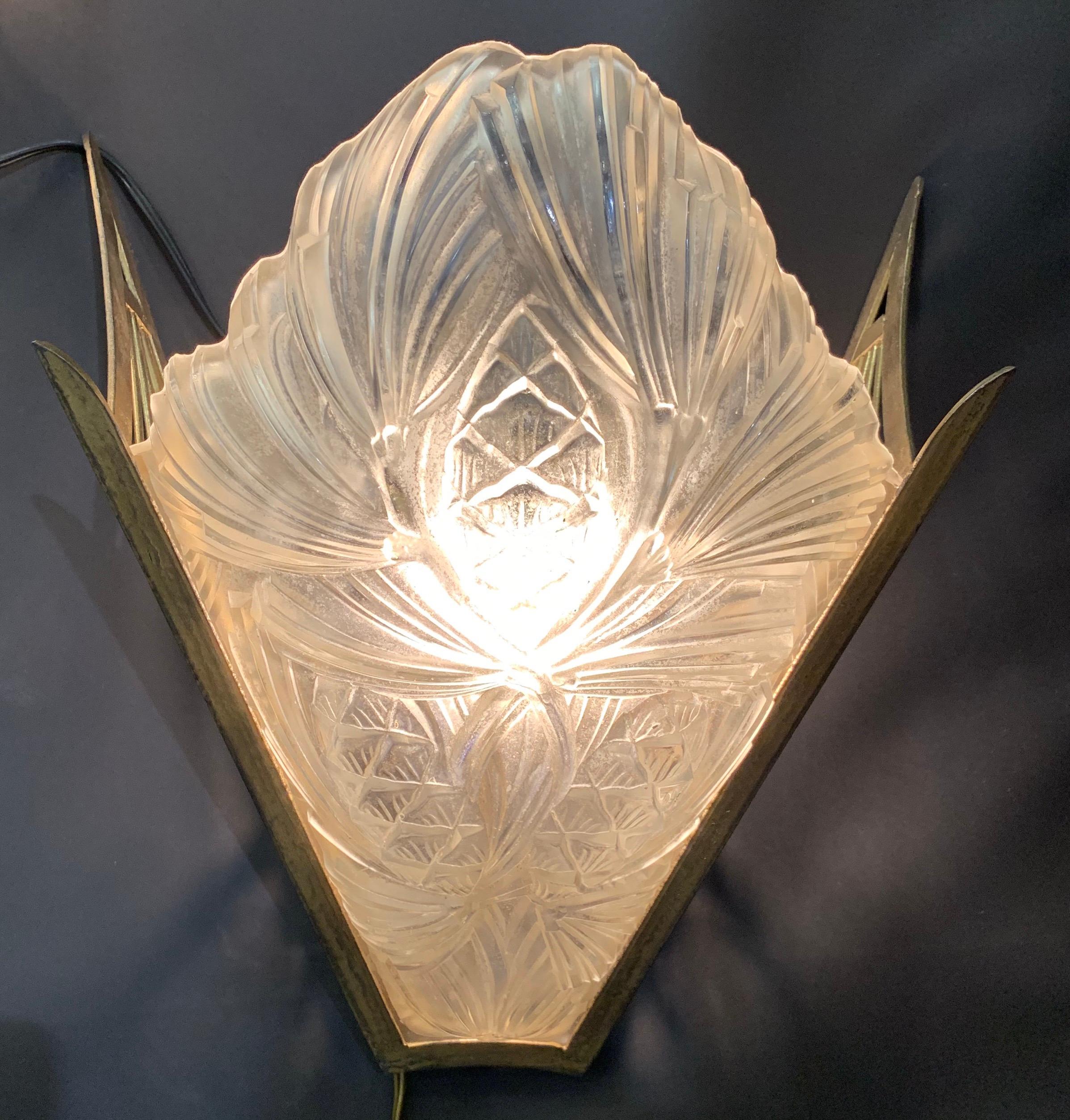 A wonderful pair French Art Deco slip shade glass wall sconces in the manner of Degue.