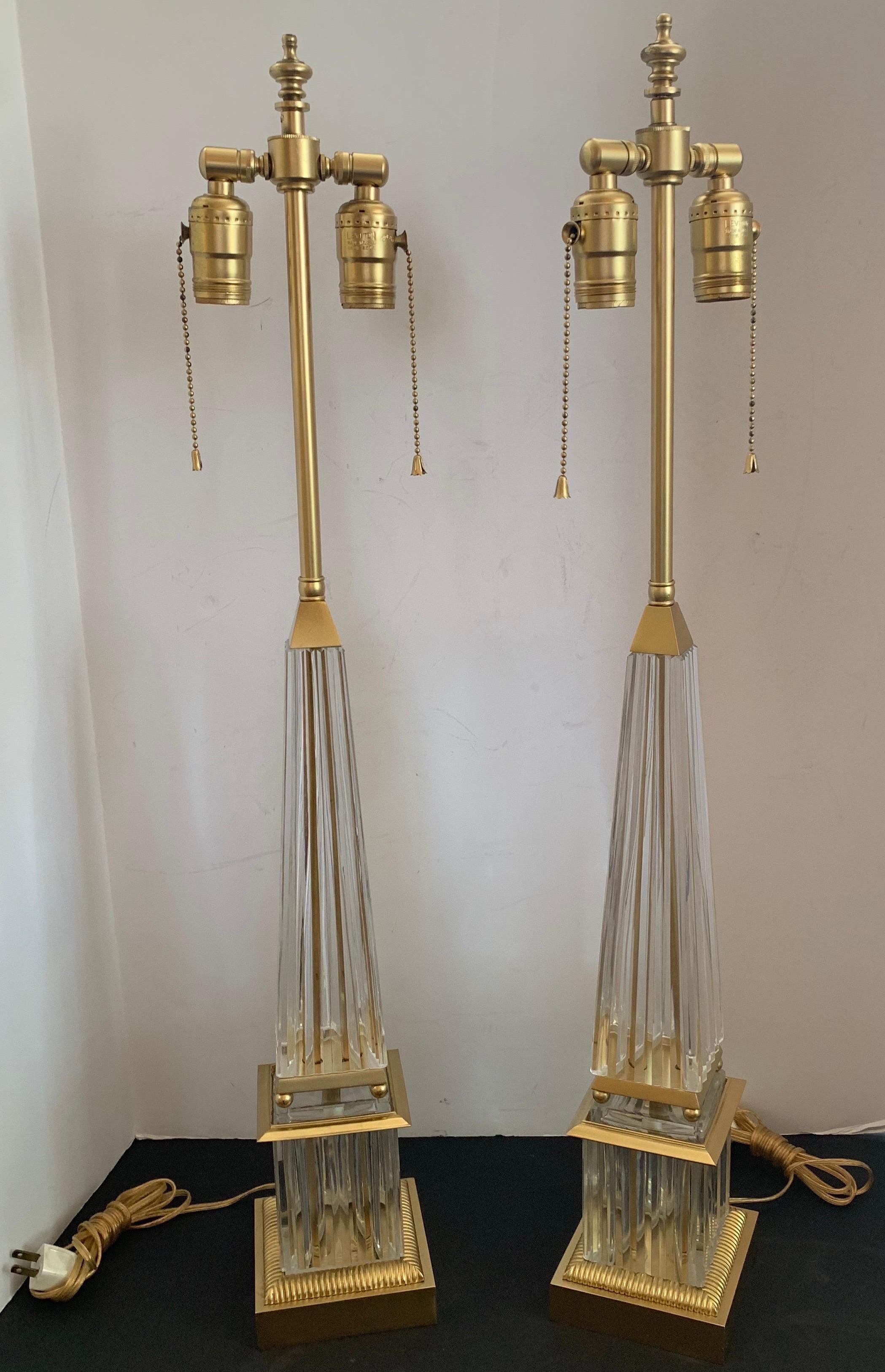 A wonderful pair of Mid-Century Modern art glass / crystal pyramid form brass / bronze obelisk lamps with 2 Edison lights each.