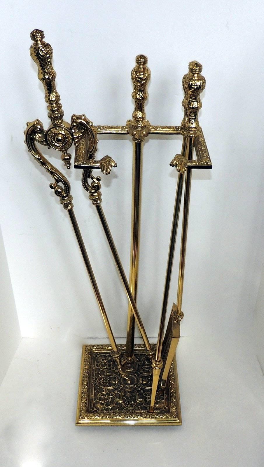 Beautifully detailed doré bronze fire place tool set with tongs, shovel, poker and stand, circa 1920s. Stand is 31