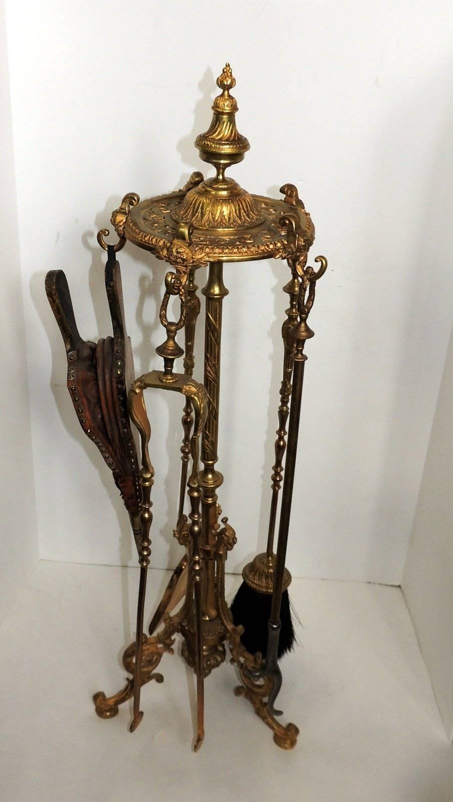 A wonderful beautifully decorated 19th century French doré bronze fire place tool set includes: Stand 33