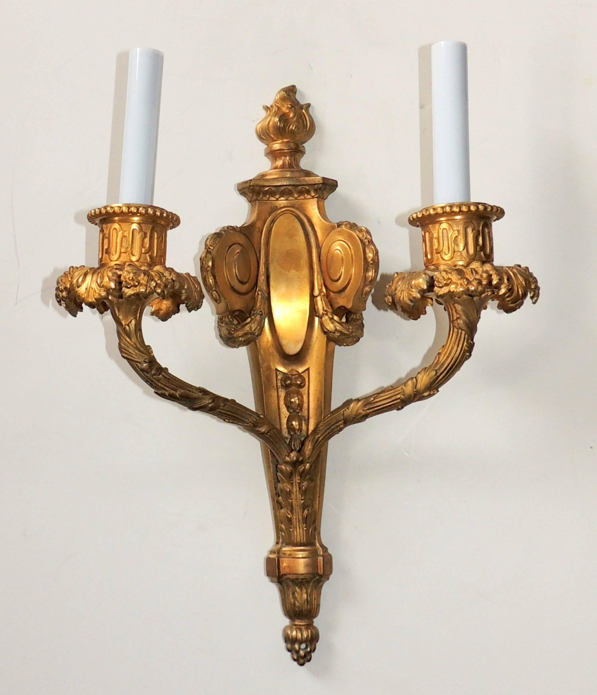 Exceptional pair of French doré bronze fine neoclassical flame top sconces.
Measures: 16