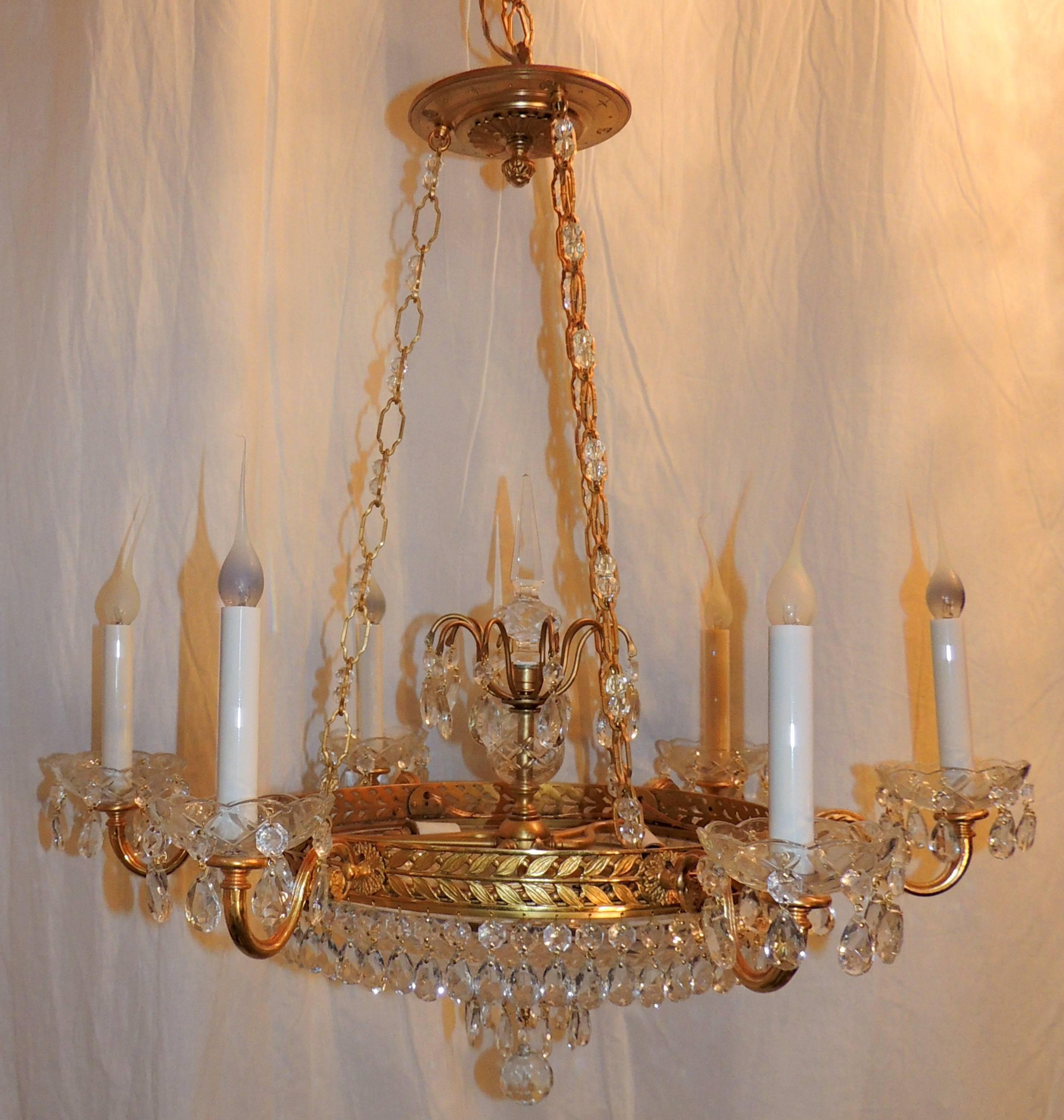 A wonderful French dore bronze neoclassical style Baltic cut crystal bowl Empire chandelier with six lights and three internal lights.