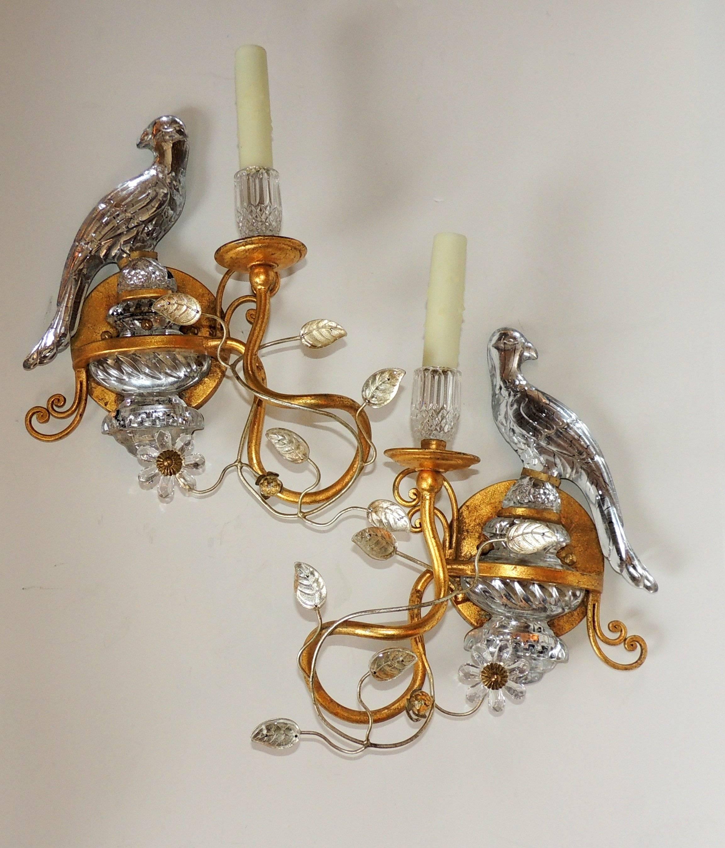 This endearing set of Bagues style vintage gilt and crystal sconces are beautifully balanced with leaves and the crystal urn the bird is sitting on. Simple crystal bobeches set off the crystal candle cup sitting next to the bird. There is a right