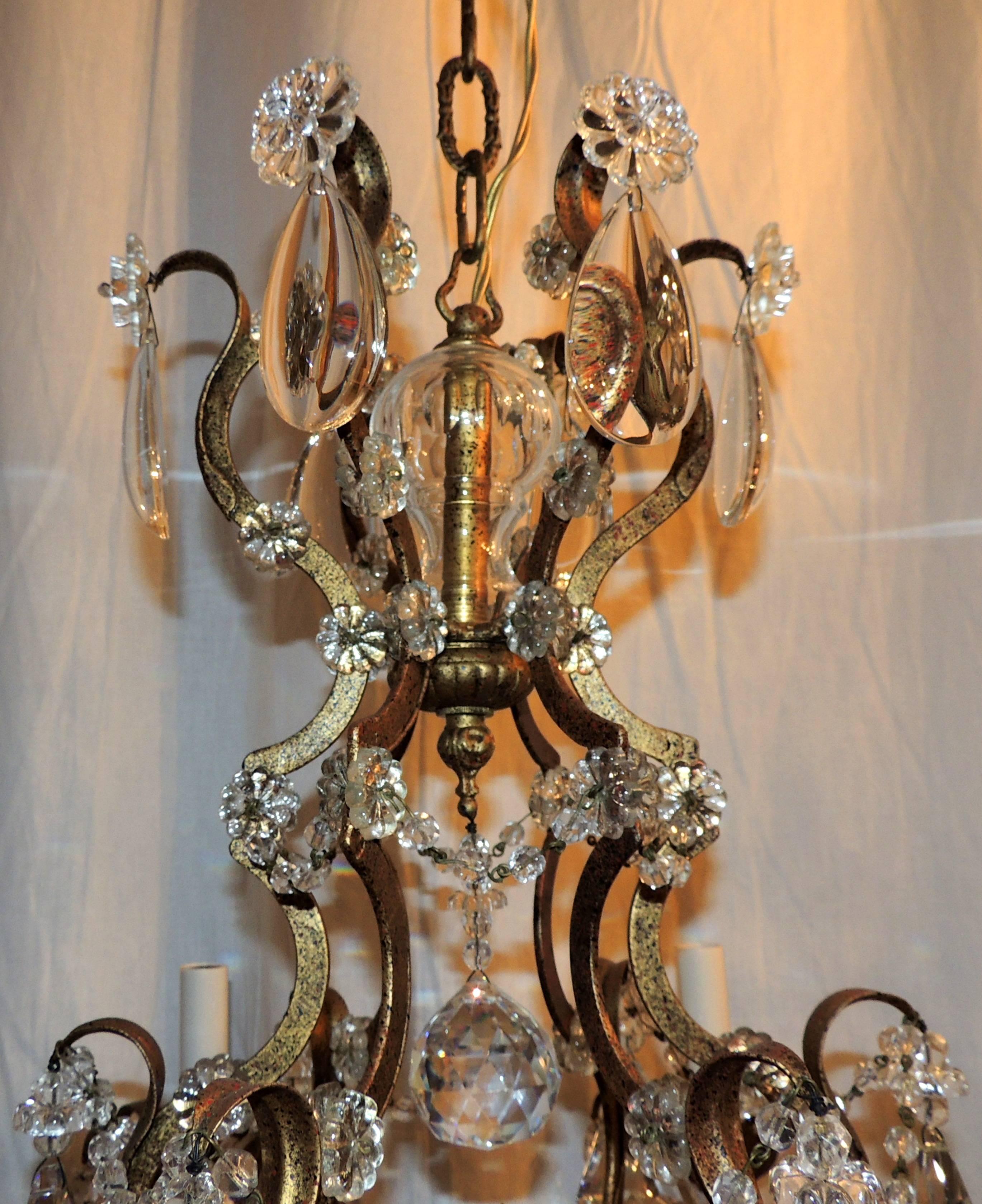 A wonderful French gilt bronze and cut crystal Baguès style chandelier with beading and crystal flower.