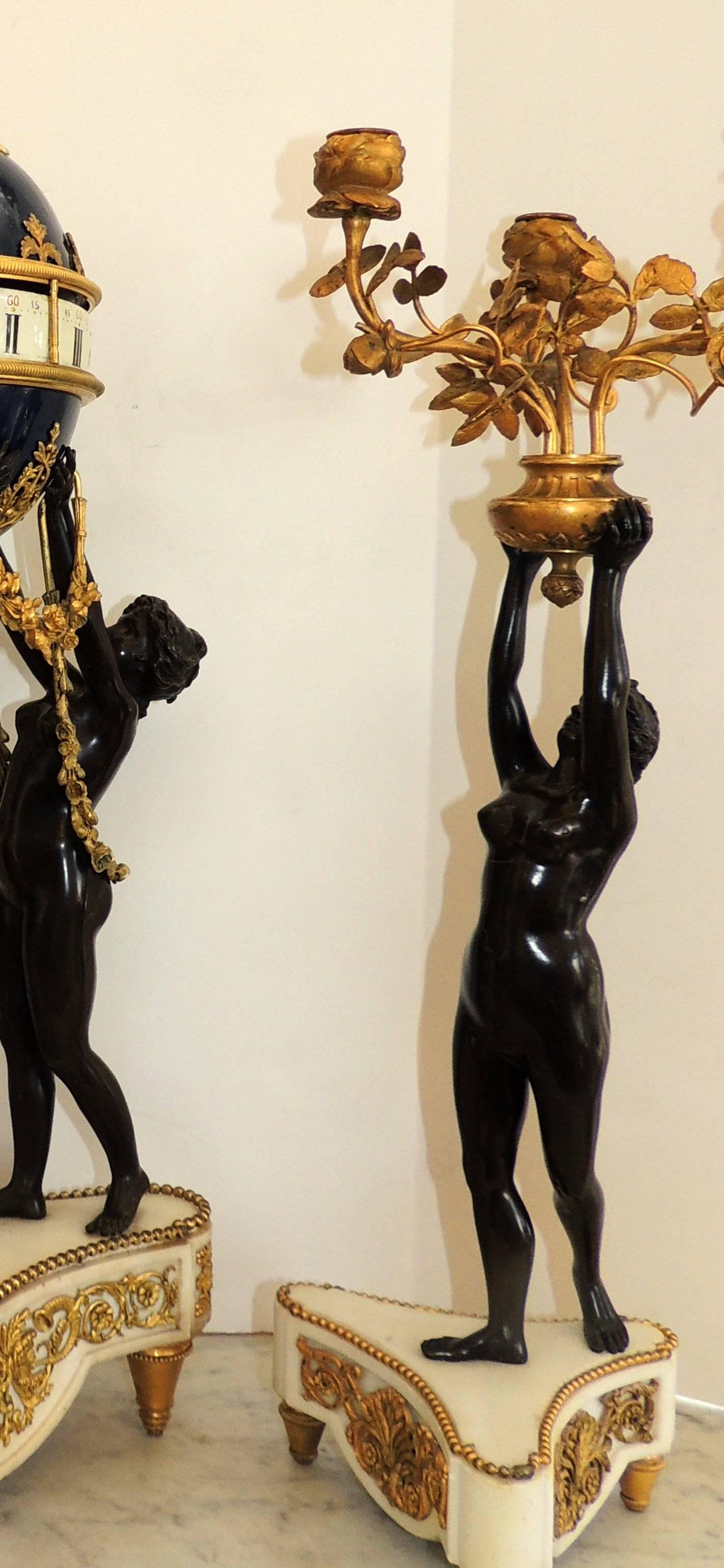 Louis XVI Exceptional French Three-Piece Rotary Mystery Clock Set Maiden Candelabra Suite
