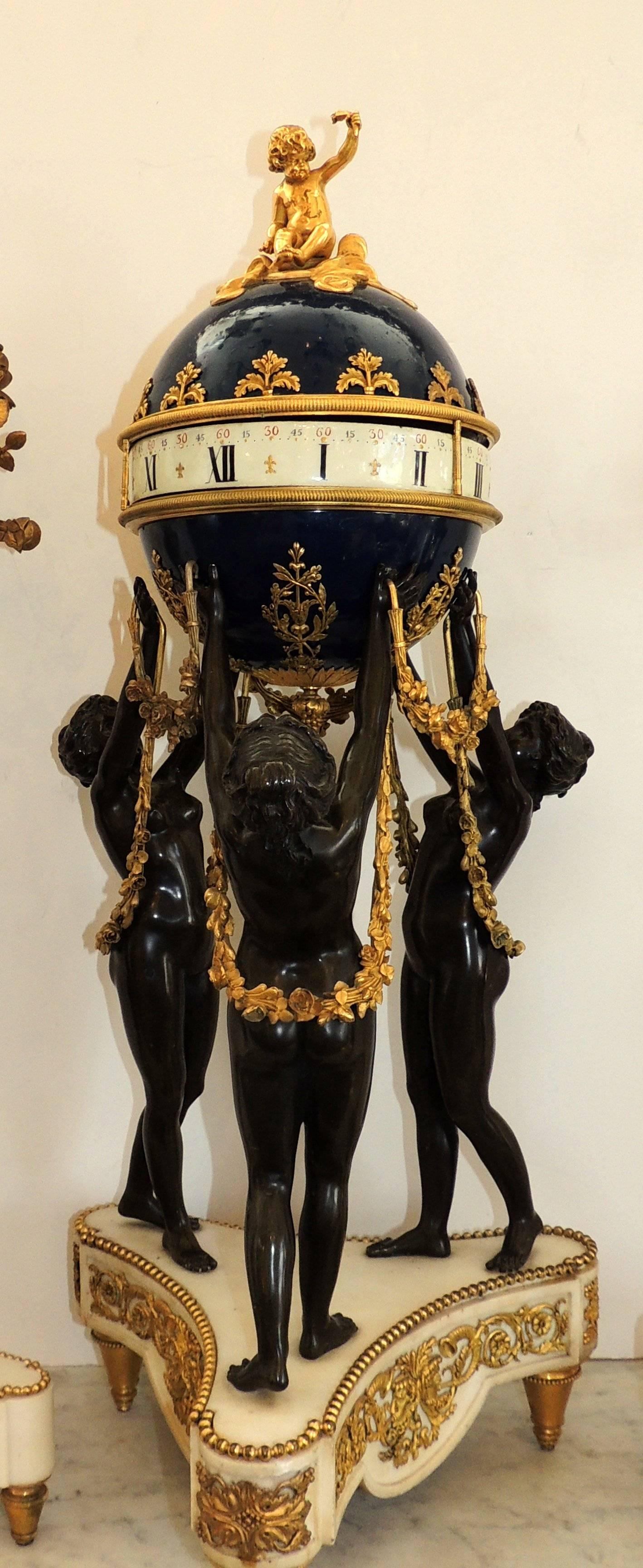 Gilt Exceptional French Three-Piece Rotary Mystery Clock Set Maiden Candelabra Suite