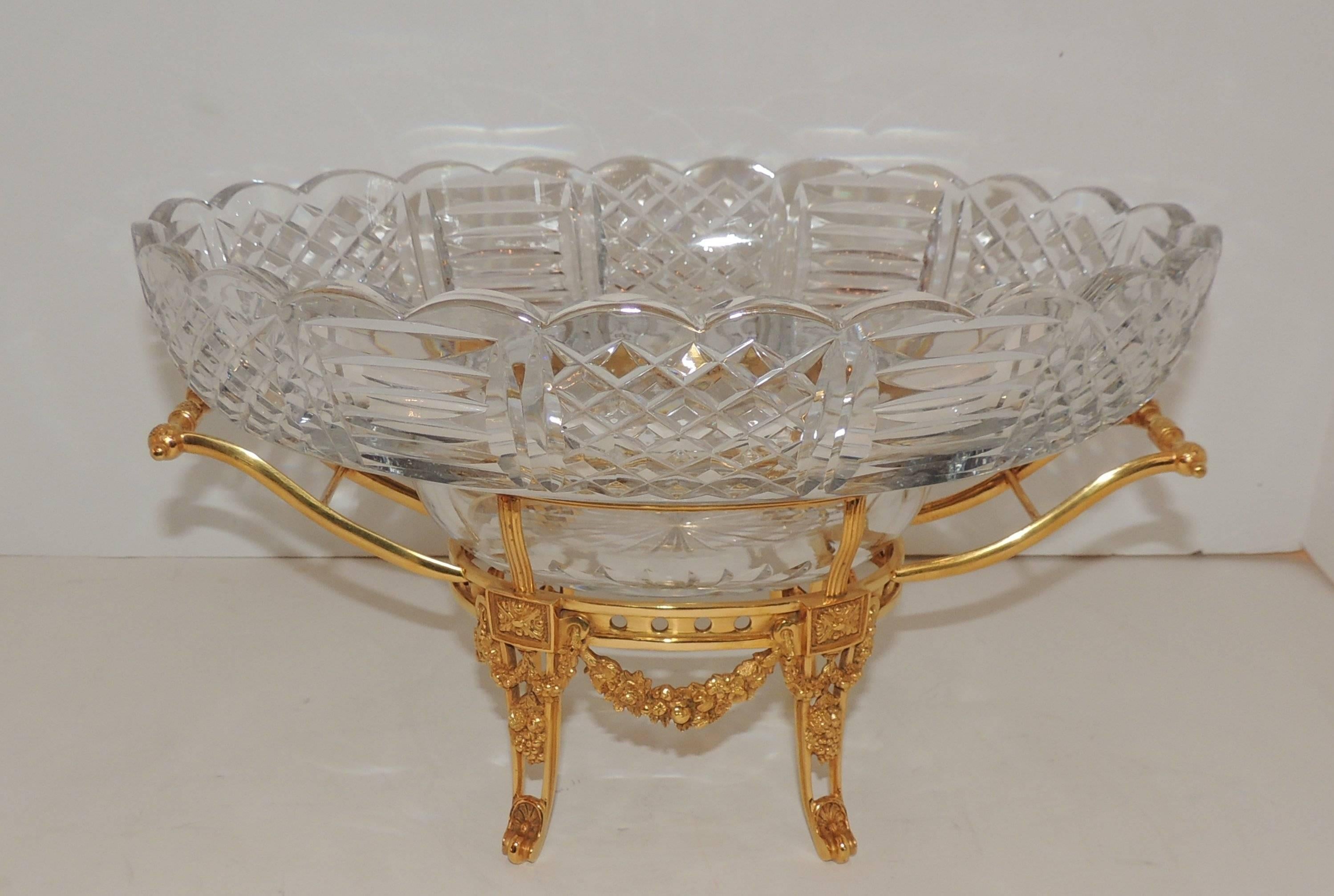 Delicate French dore bronze filigree swag and wreaths on handled frame hold the multi faceted cut crystal insert and scalloped top edge.
Beautiful piece for your home or office.

Measures: 13" L x 7.5" H x 8.5" D.