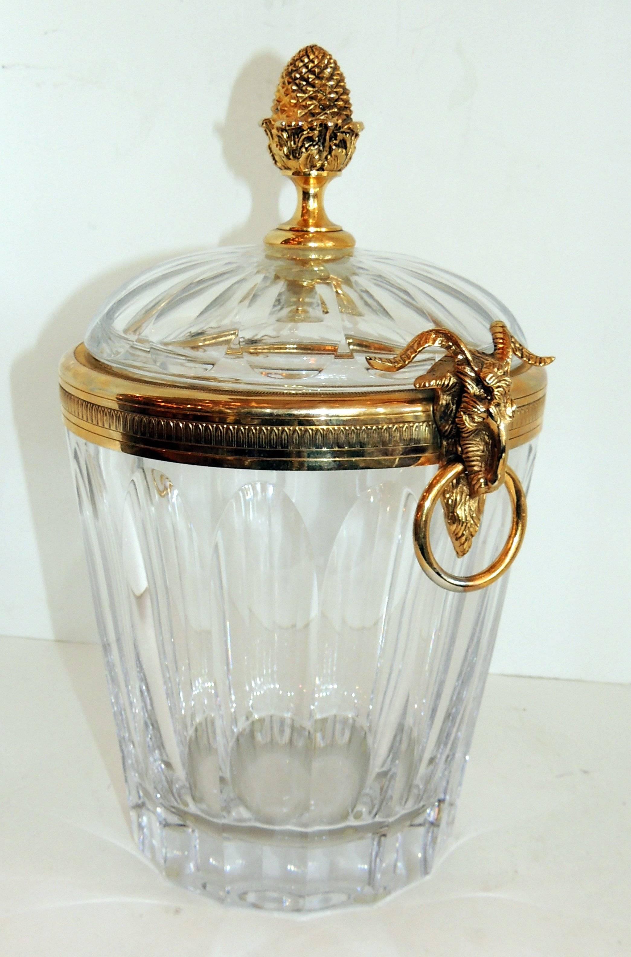 Wonderful Martin Benito signed crystal gilt bronze ormolu ram handle ice bucket by an amazing artist. The crystal and bronze are in wonderful condition.

Measures: 14" H x 8" W.