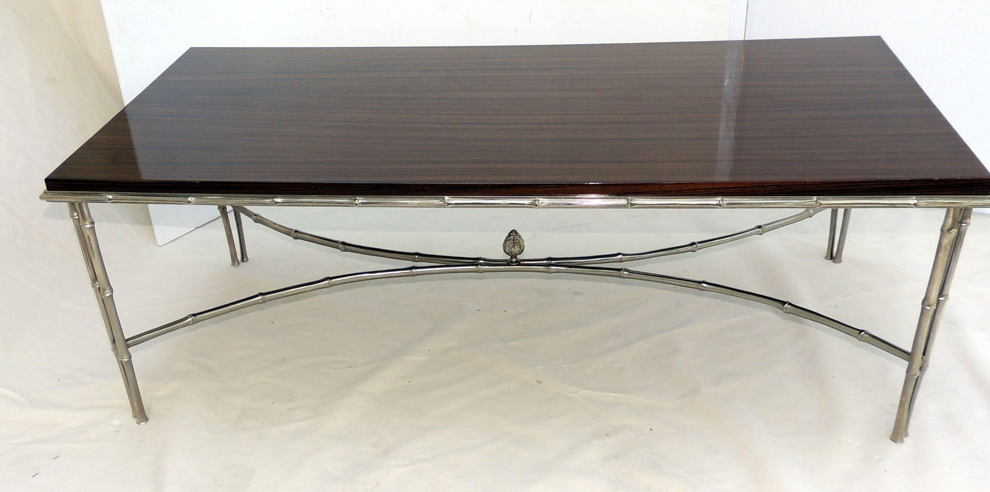 Wonderful polished nickel Makassar ebony silvered bronze bamboo Baguès cocktail or coffee table.

Measures: 44 L x 21 W x 15 H.