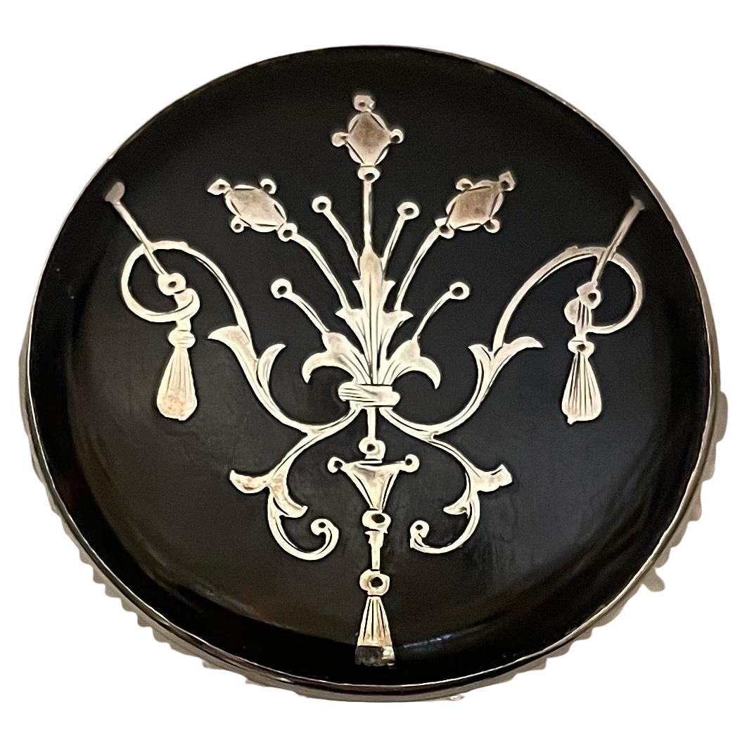 A Wonderful Sterling Silver And Tortoise Shell Perfume Bottle With A Hinged Silver And Tortoise Shell Pique Inlaid Lid. The Clear Cut Crystal Bottle Has Been Delicately Engraved And Has The Original Glass Stopper