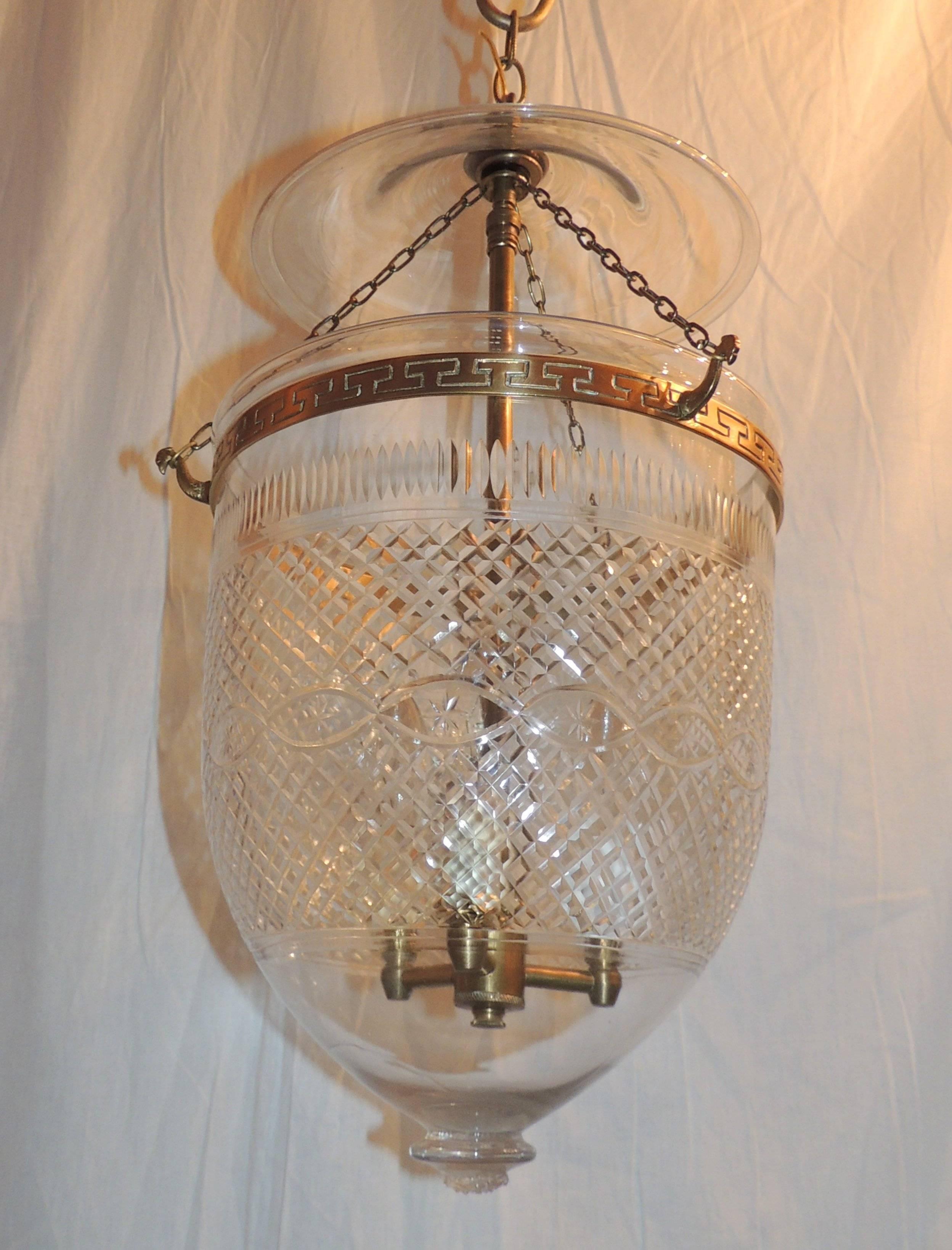 Pair of cut and etched crystal bell lanterns with bronze Greek key design.

Measures: 10