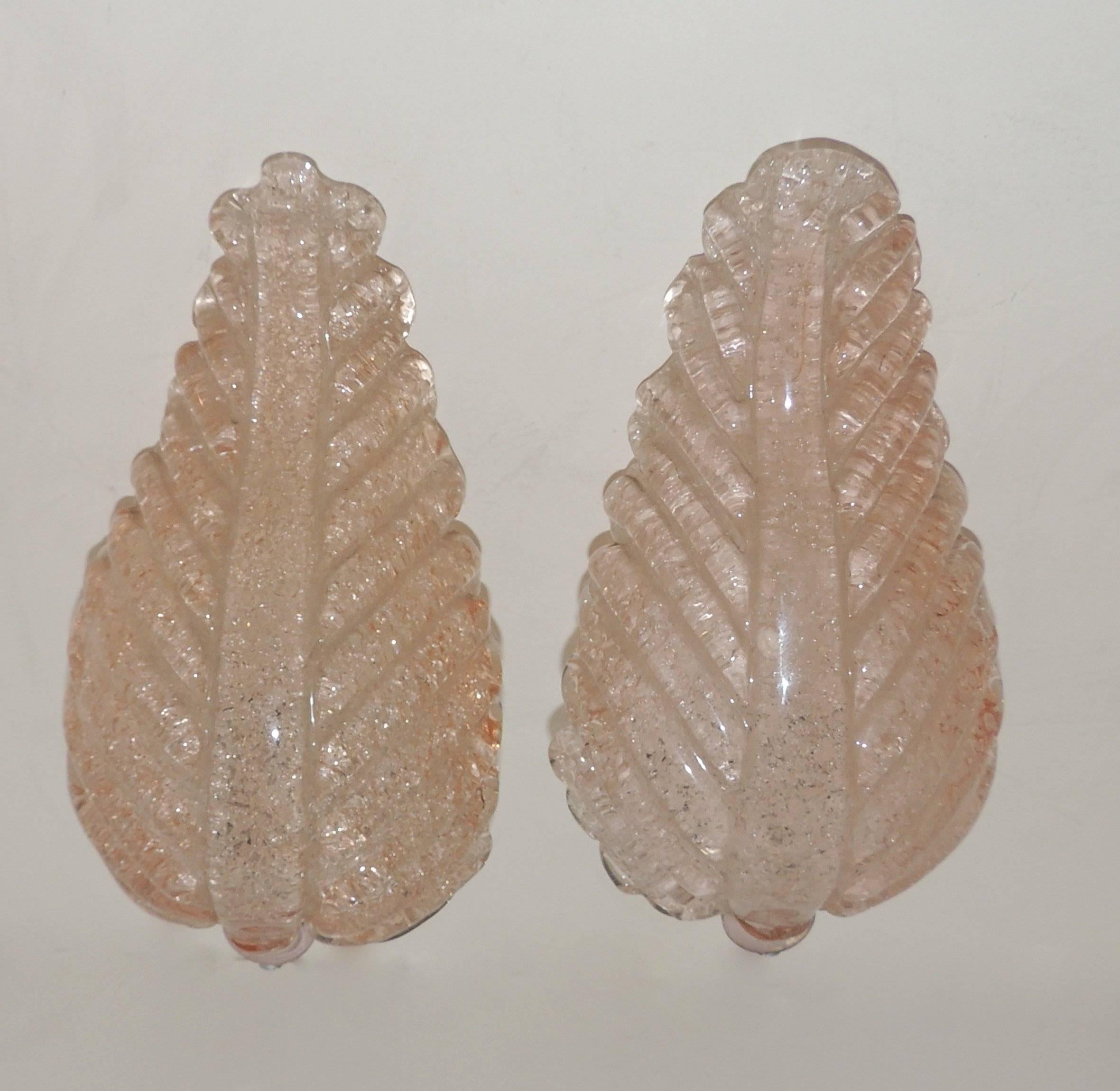 Wonderful pair of Murano glass pink leaf form Italian sconces with single lights.
Subtle pink color, beautiful glass.

Measures: 10