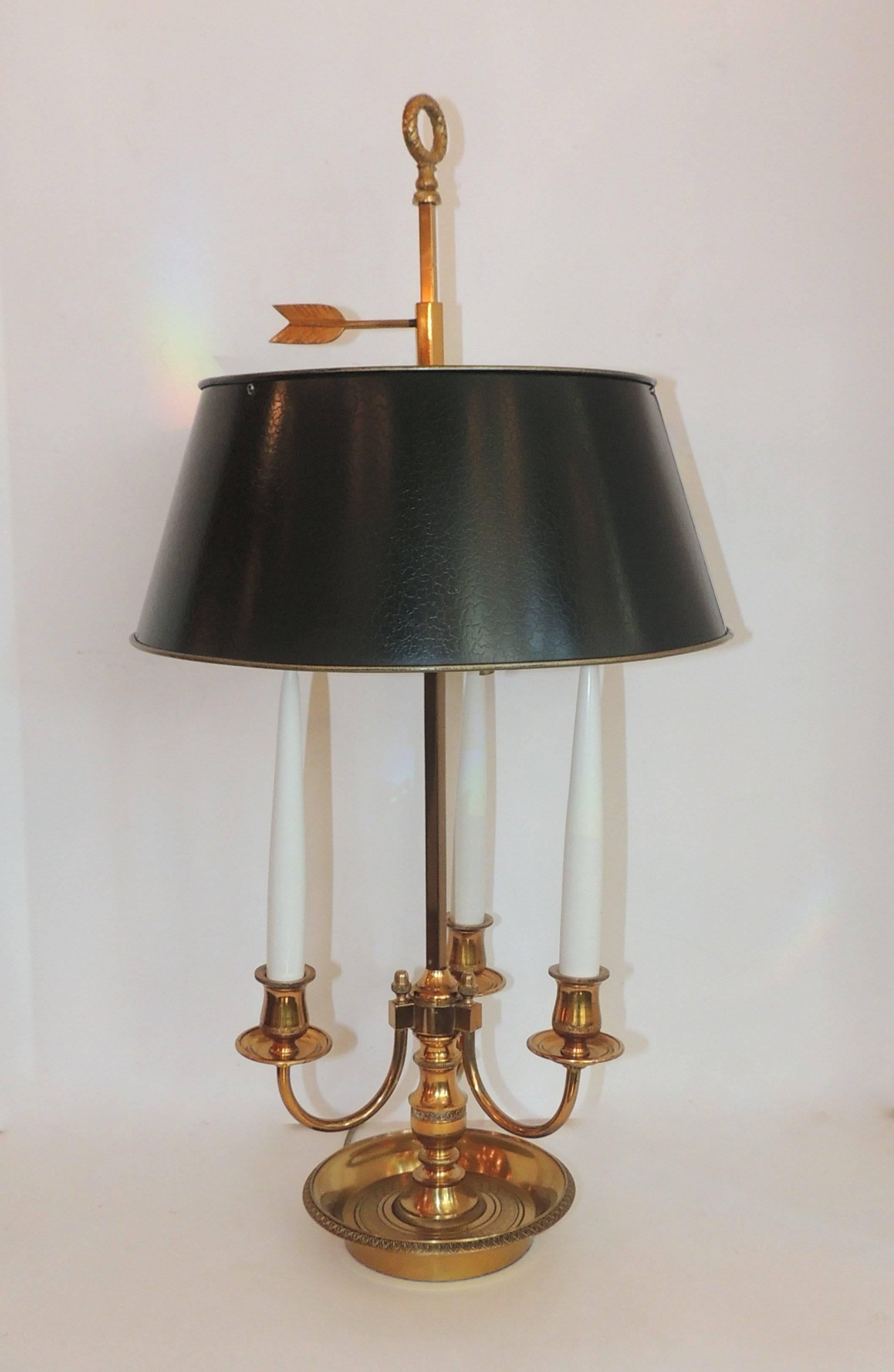 Wonderful French Bouillotte two-light lamp with three candles.
Beautiful etched detail on base and up the center candle cups. Set of three candles and two lights in the lamp. Tole lamp shade in wonderful condition.

Measures: 26