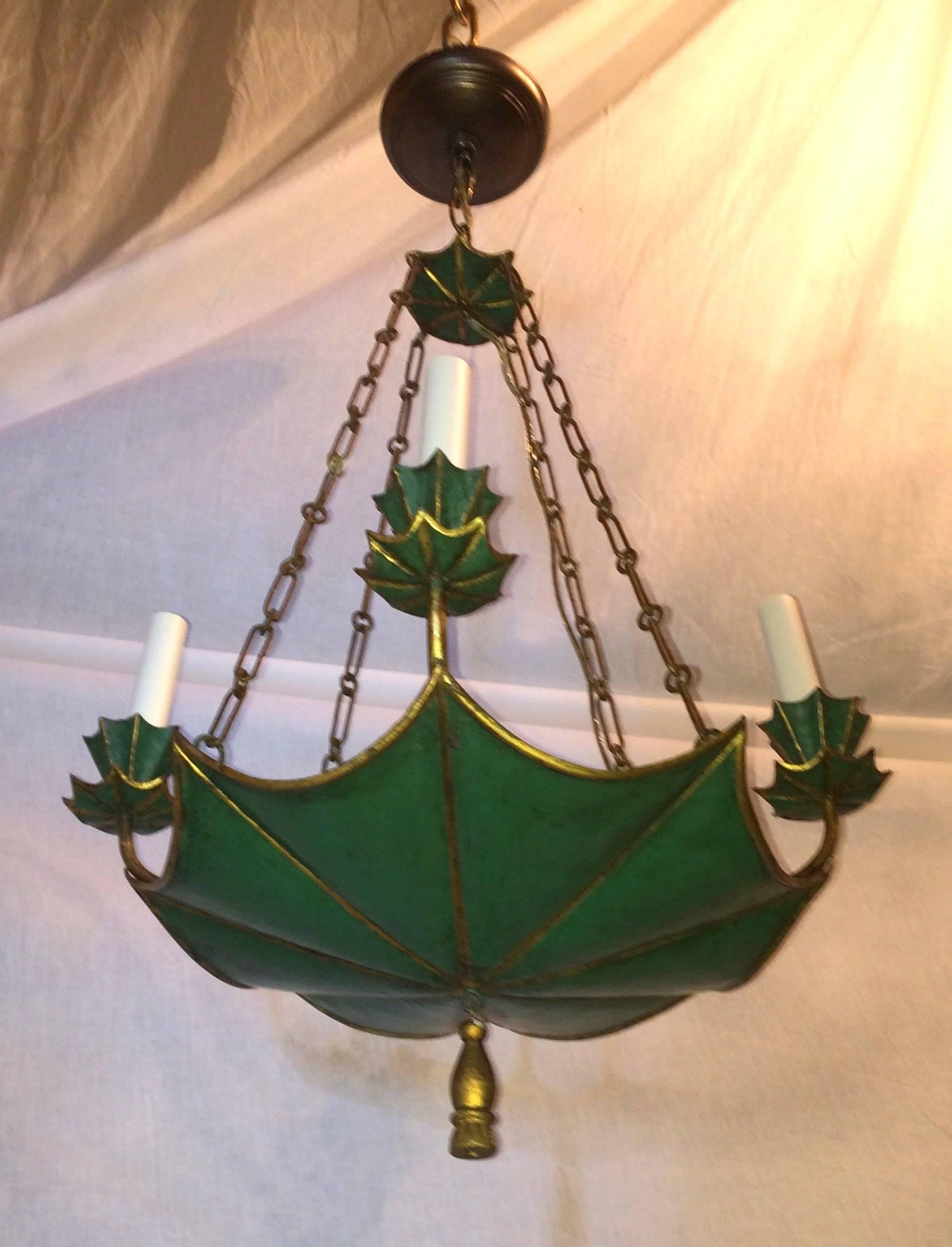 Wonderful green and gilt tole four-light chandelier vintage fixture wood tassel.
Four lights on the outside and two lights on the in side.

Measures: 18" W x 32" H (adj. height).
