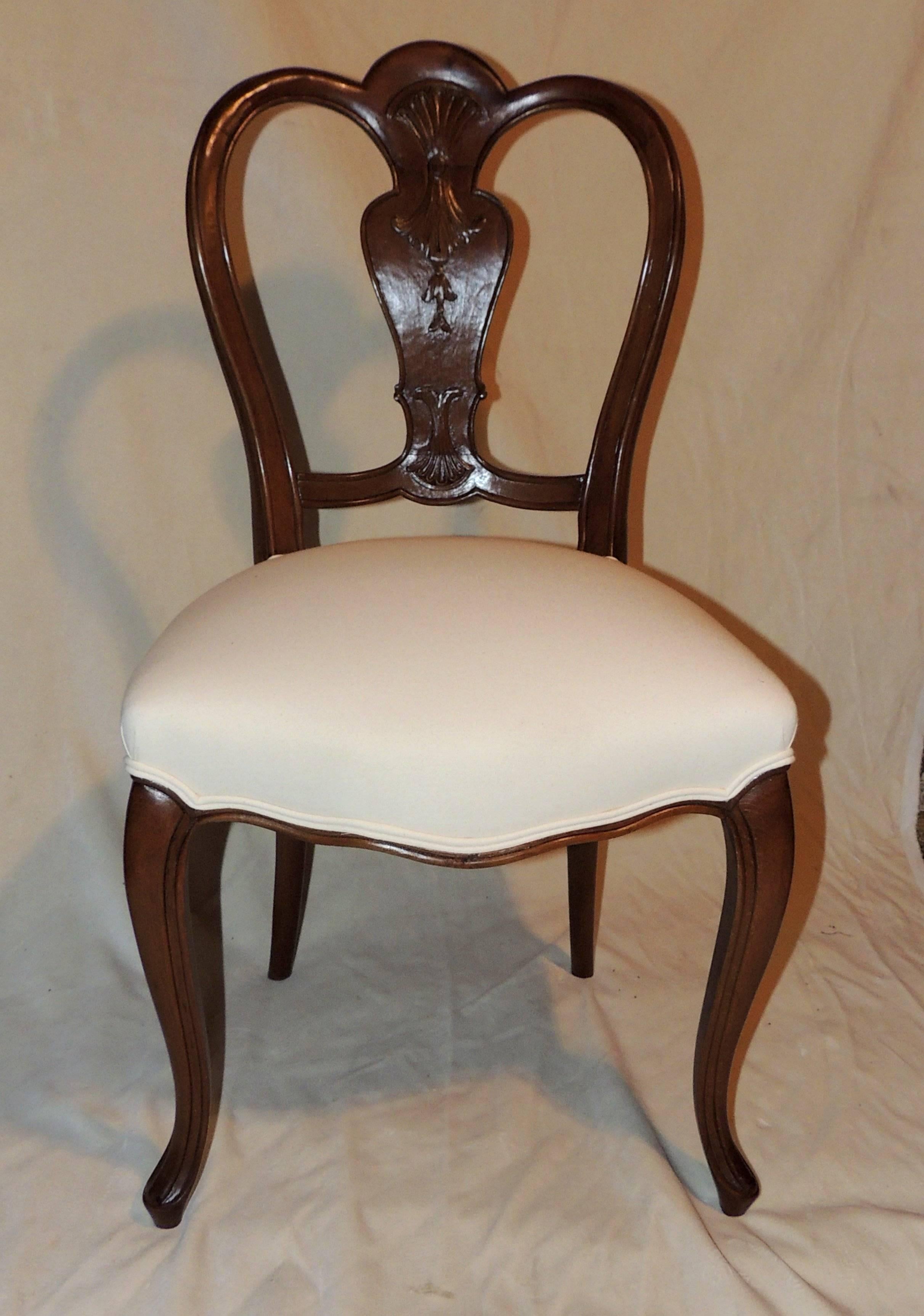Wonderful shield back set of six French leg carved back side upholstered chairs recently refinished.

Measures: 19