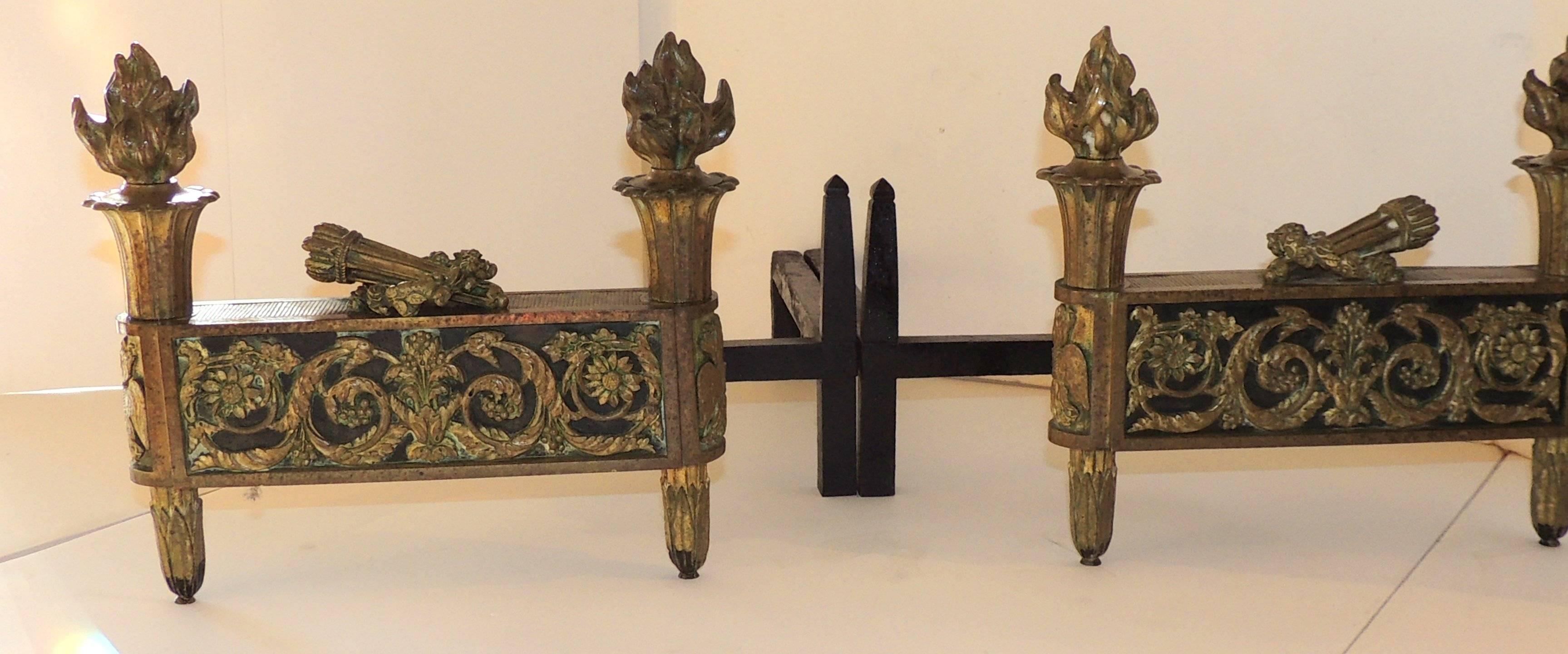 
Wonderful French Neoclassical Gilt Dore Bronze with Black Marble Insert Chenets.

Measures: 12.5" W x 11" H x 19" D.