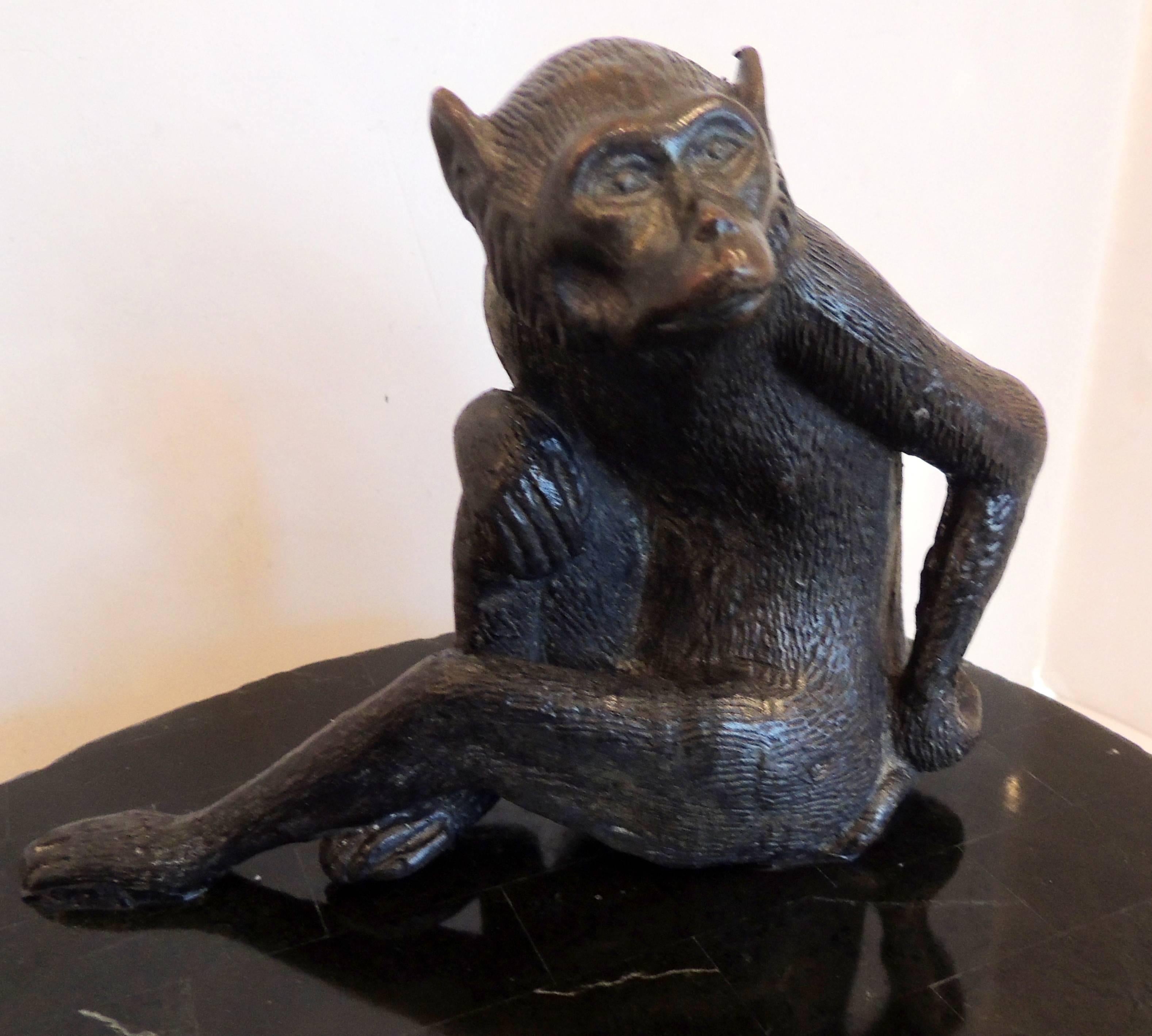 A wonderful Maitland smith stone box, casket with lined wood interior and finished with bronze-mounted monkey sculpture on top.