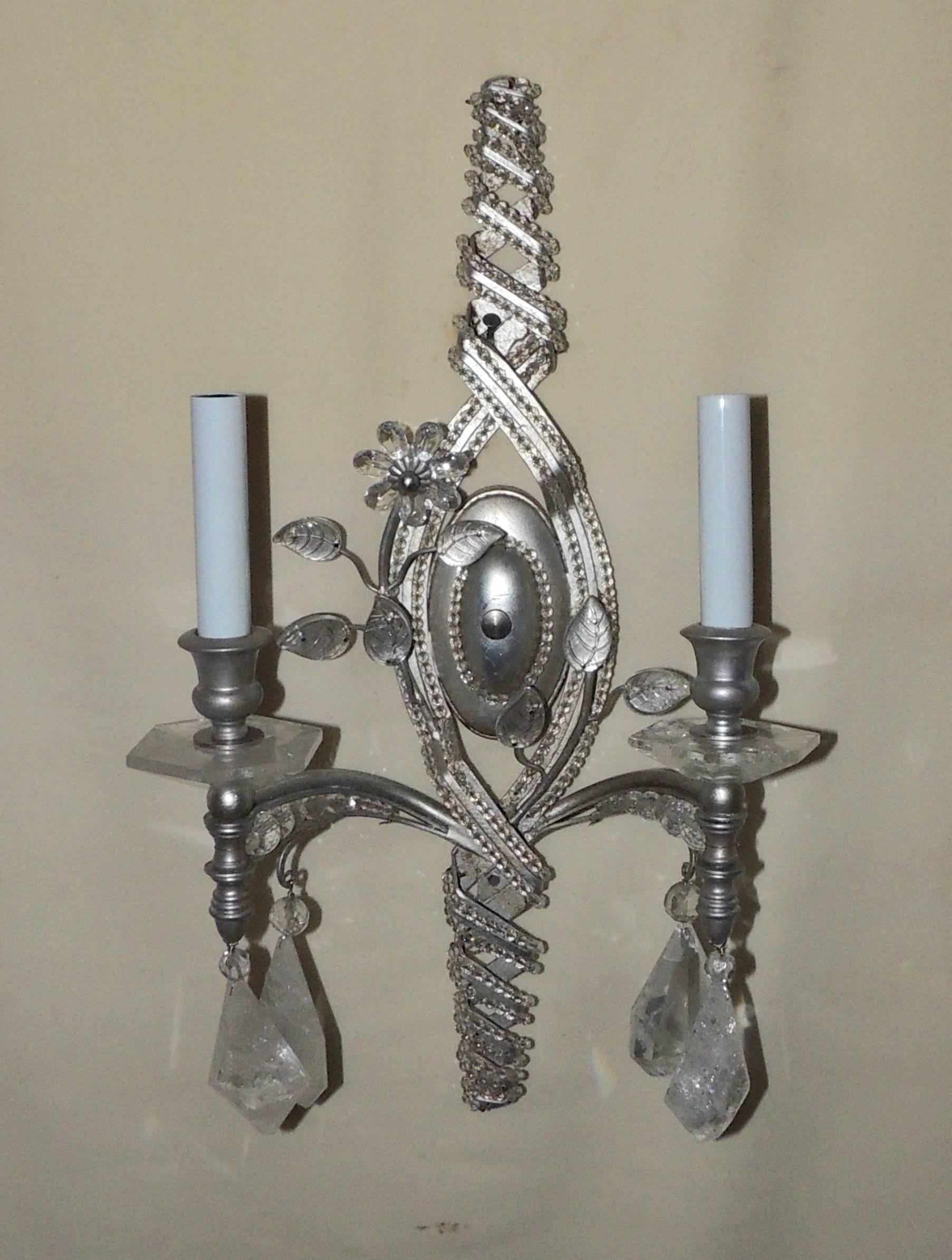 Elegant pair of transitional silver sconces with rock crystal bobeches and pendants and crystal beads throughout these two-arm sconces.

Measures: 20