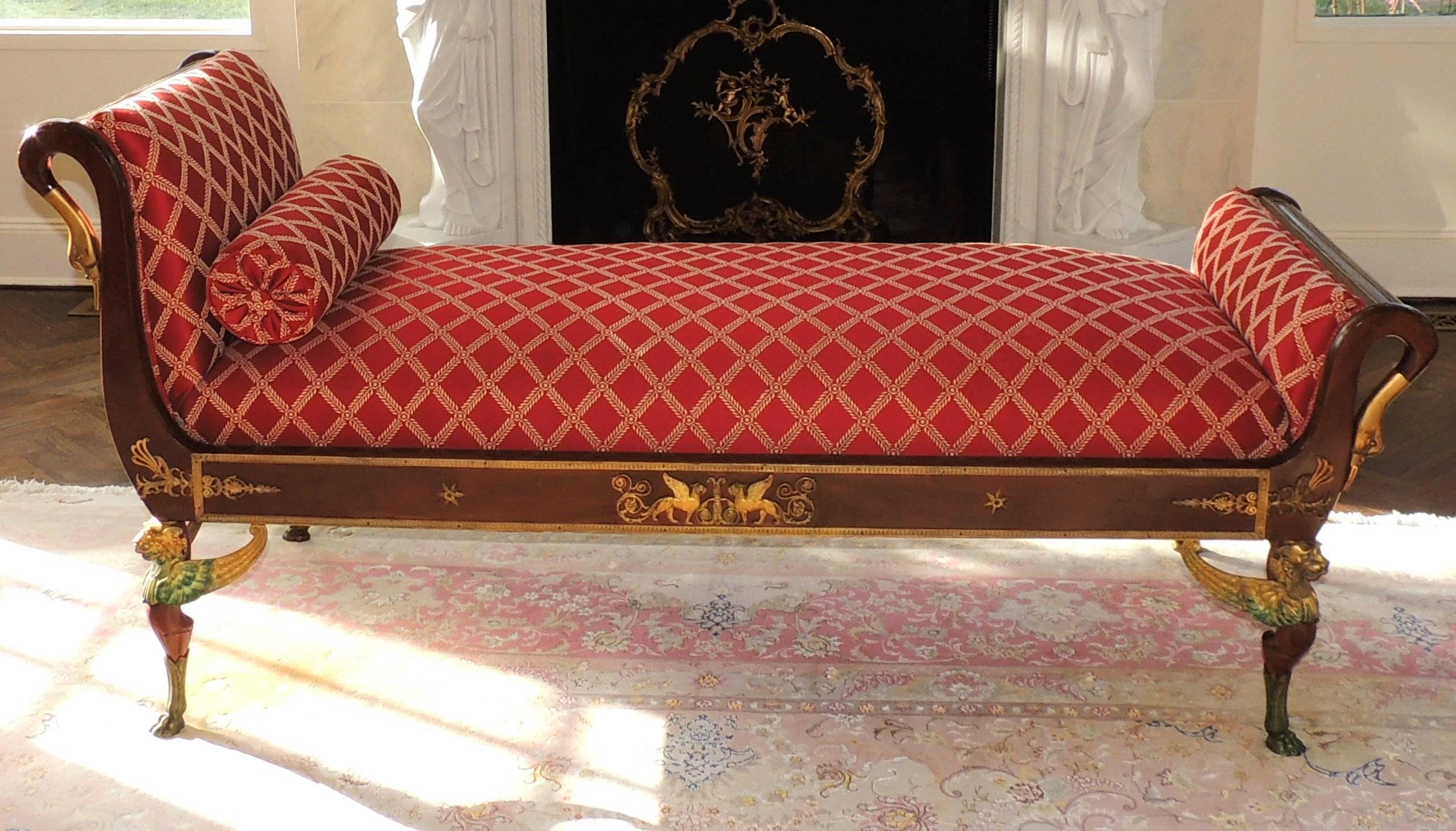 Wonderful parlour chaise longue sofa with gilt bronze ormolu-mounted swan heads on the four corners and winged lions on the four lower corners and decorating the filigree trim around the mahogany.
New upholstery.

Measures: 34
