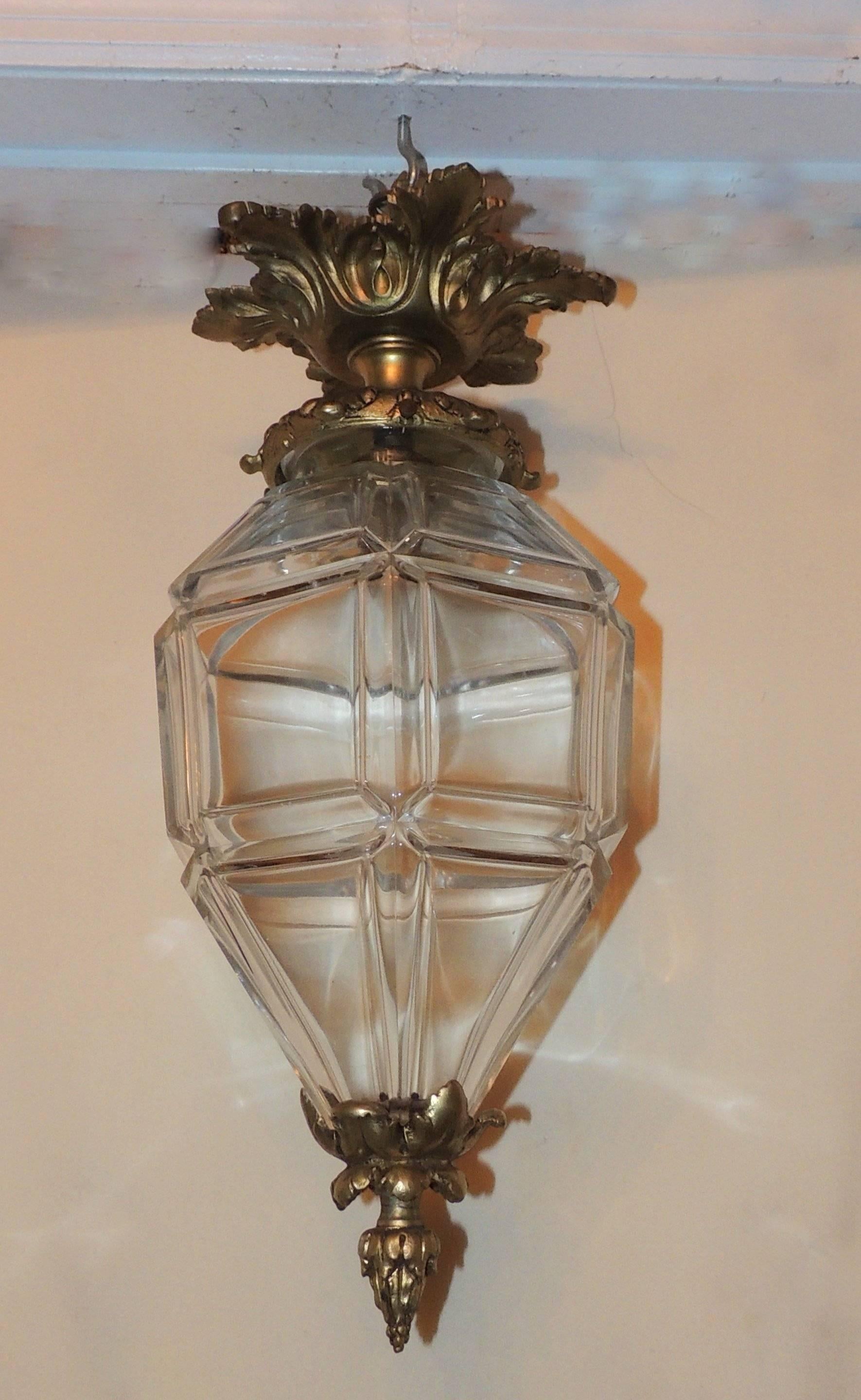 Gilt bronze lantern with beveled panel glass and filigree canopy. 

Measures: 17