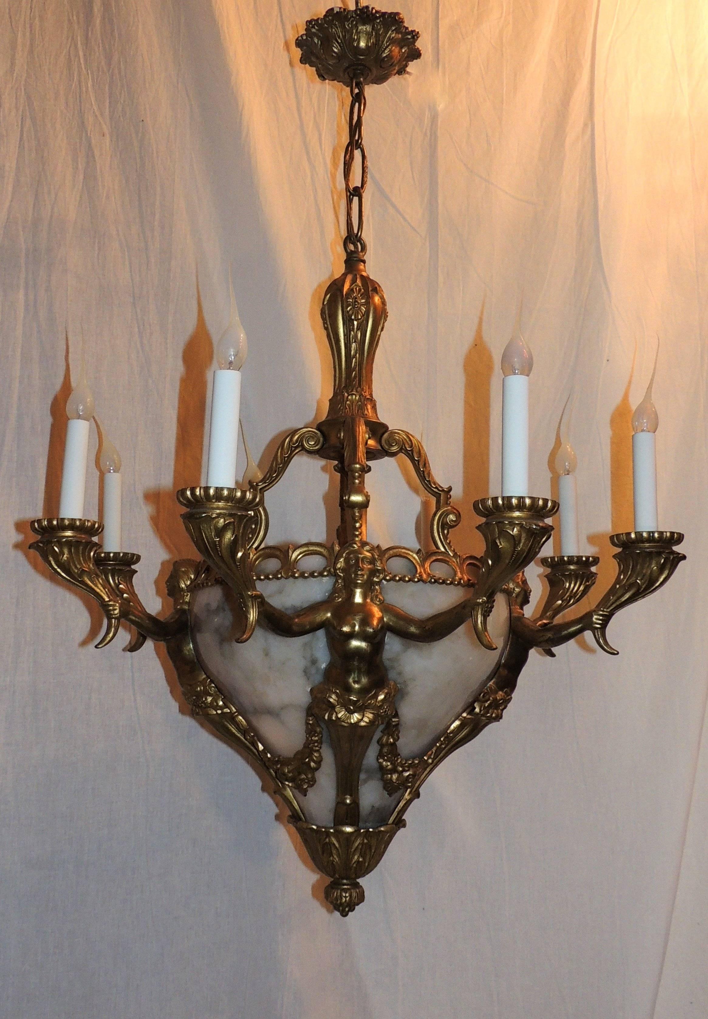 Wonderful doré bronze with alabaster insert figural Empire chandelier with eight arms and one interior light in the neoclassical manner.

Measures: 32" H x 26" W.