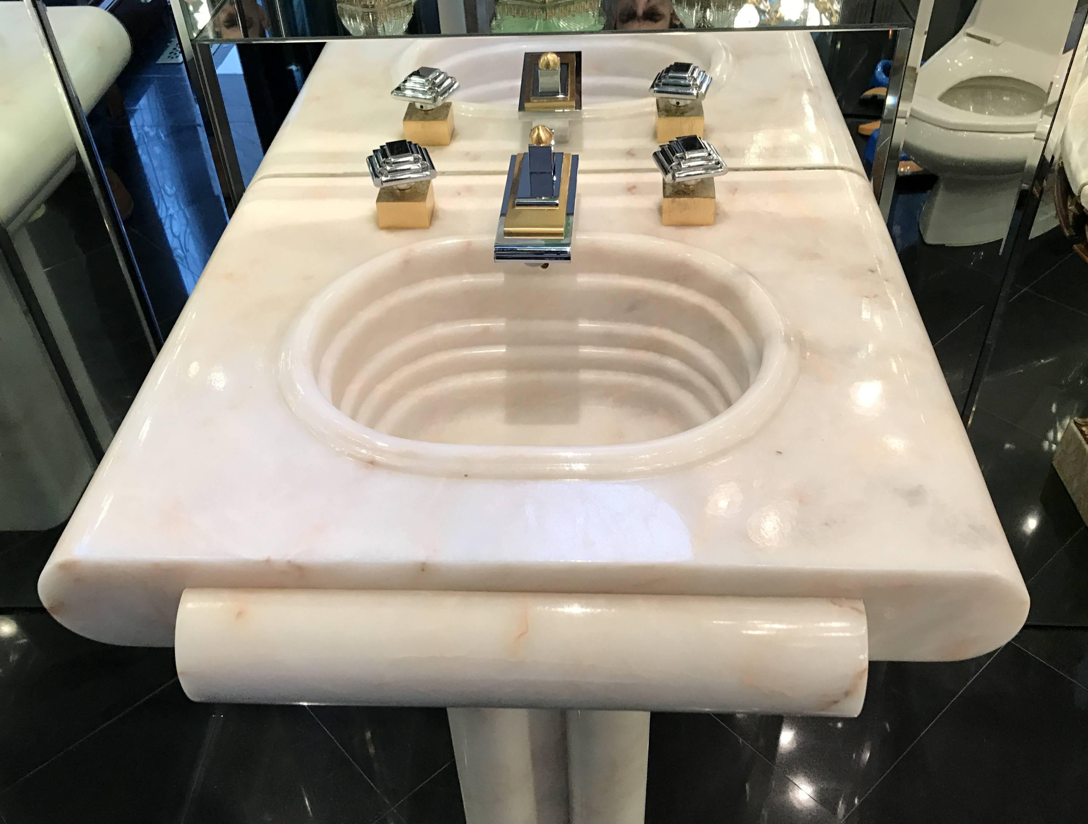 A wonderful vintage Sherle Wagner vanity sink in nickel and brass carved from a single block of onyx (Rosa Du Monte - RSDM) in the Art Deco, Nouveau design. This sink is still being offered from Sherle Wagner for over $30,000. Everything is in