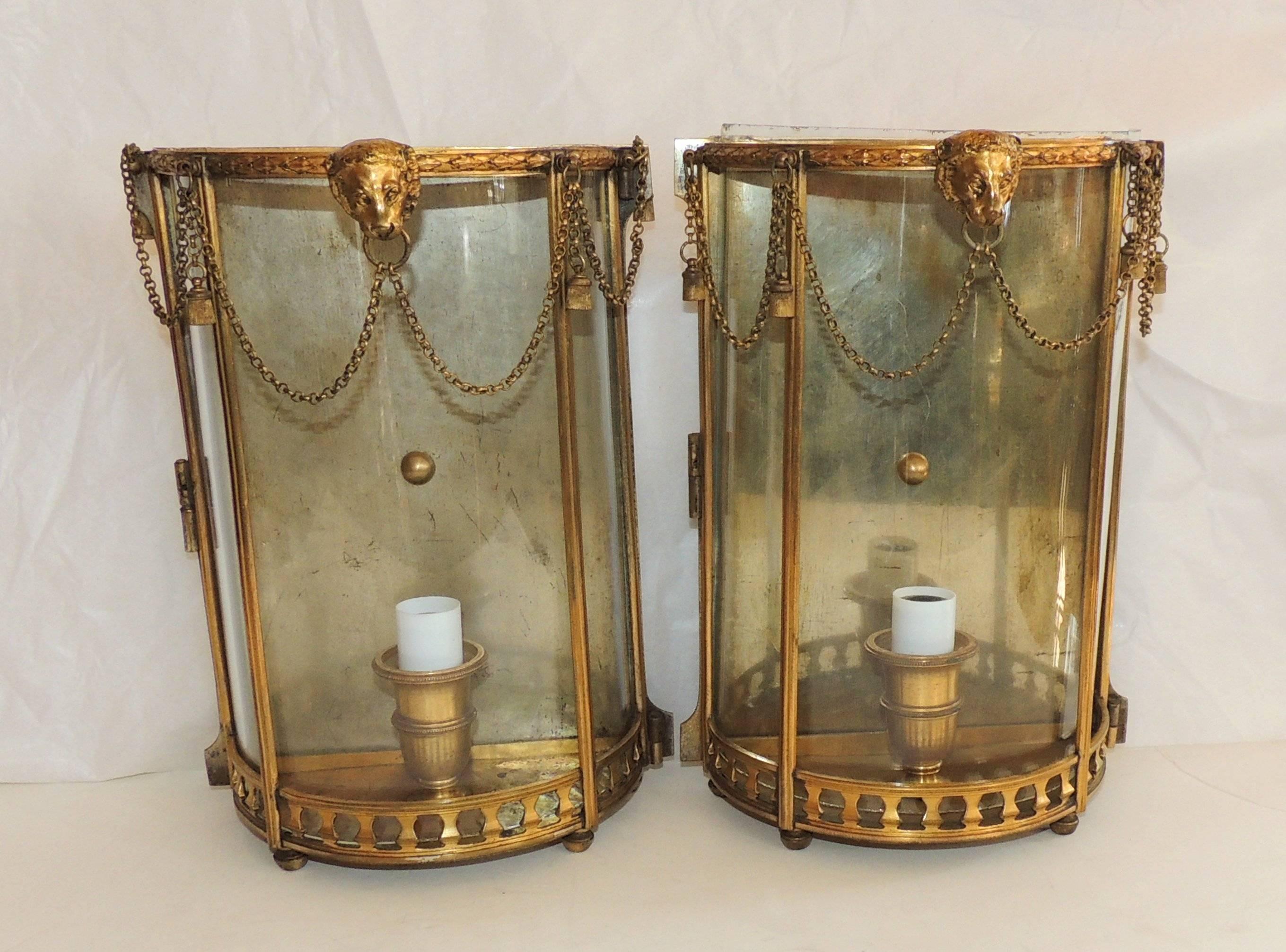 Wonderful French pair of neoclassical lion curved glass draped chain and tassels swag Caldwell Lantern style wall sconces. 

Measures: 7"W x 9.75"H x 3.75"D.