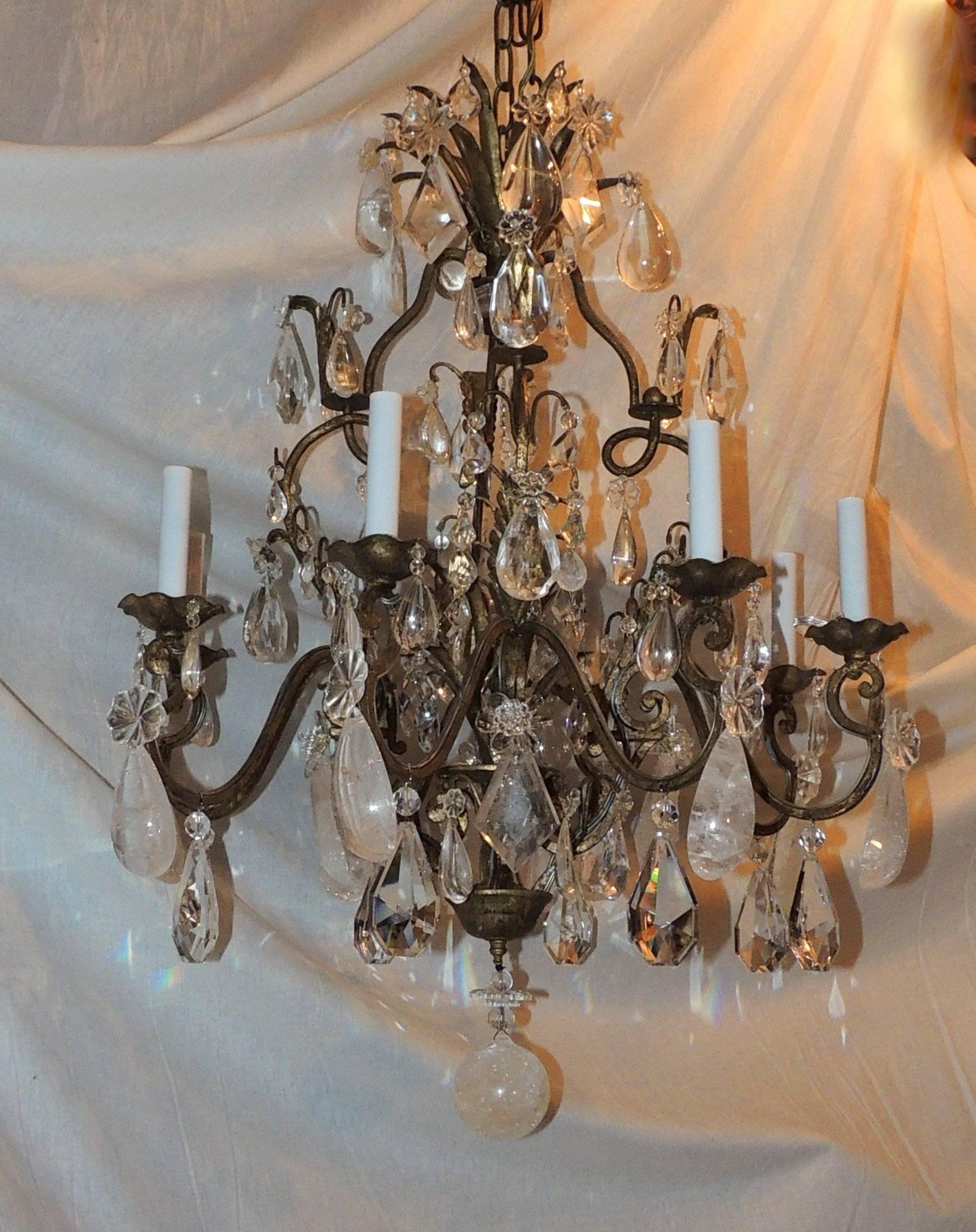 A wonderful Mid-Century Modern vintage Baguès style rock and cut crystal gilt Jansen period chandelier eight-light fixture.
Completely rewired and ready to enjoy.

Measures: 26