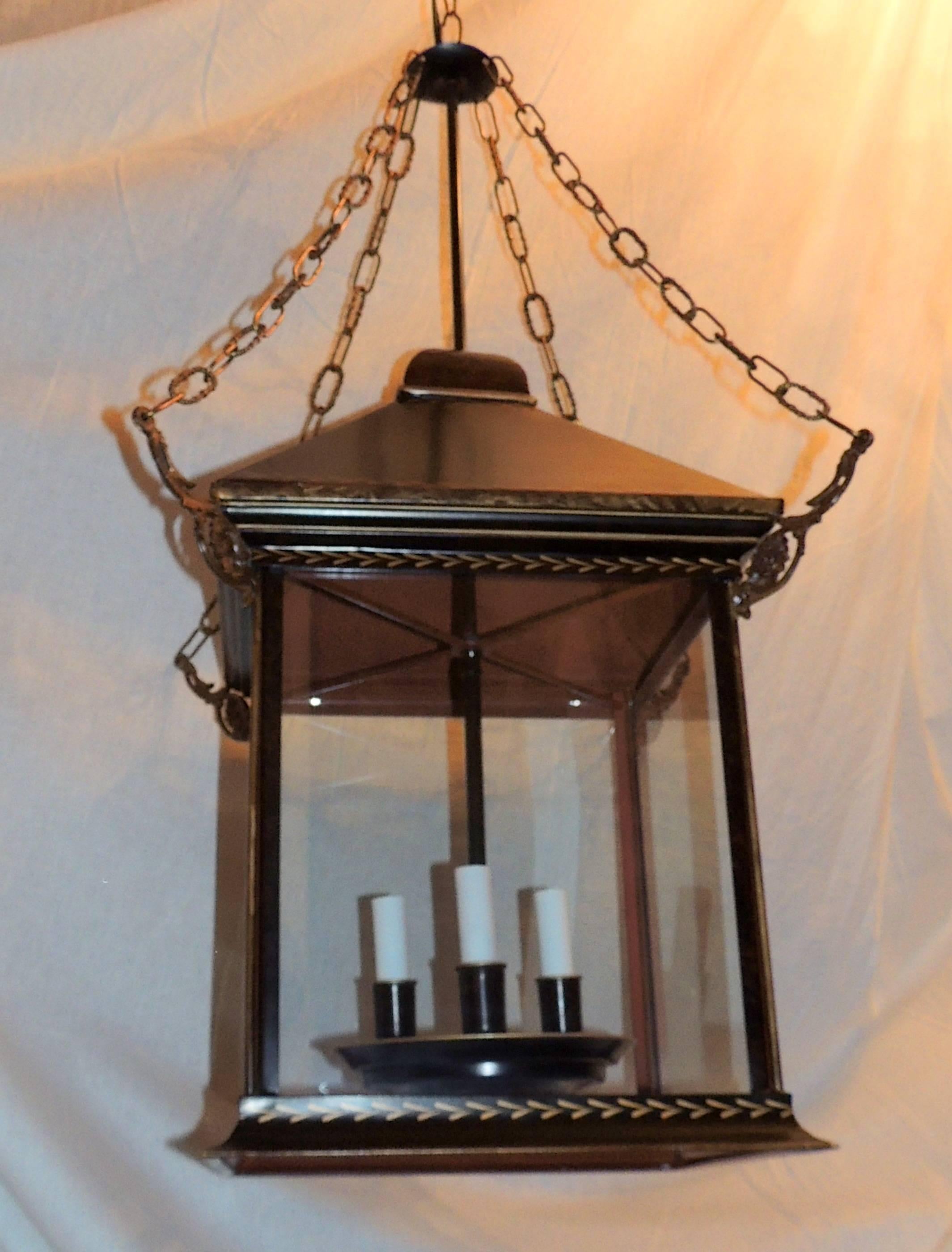 A wonderful vintage tole brown distressed leather and gold gilt three-light large glass square lantern pendent fixture.

Measures: 18" square x 36" high.