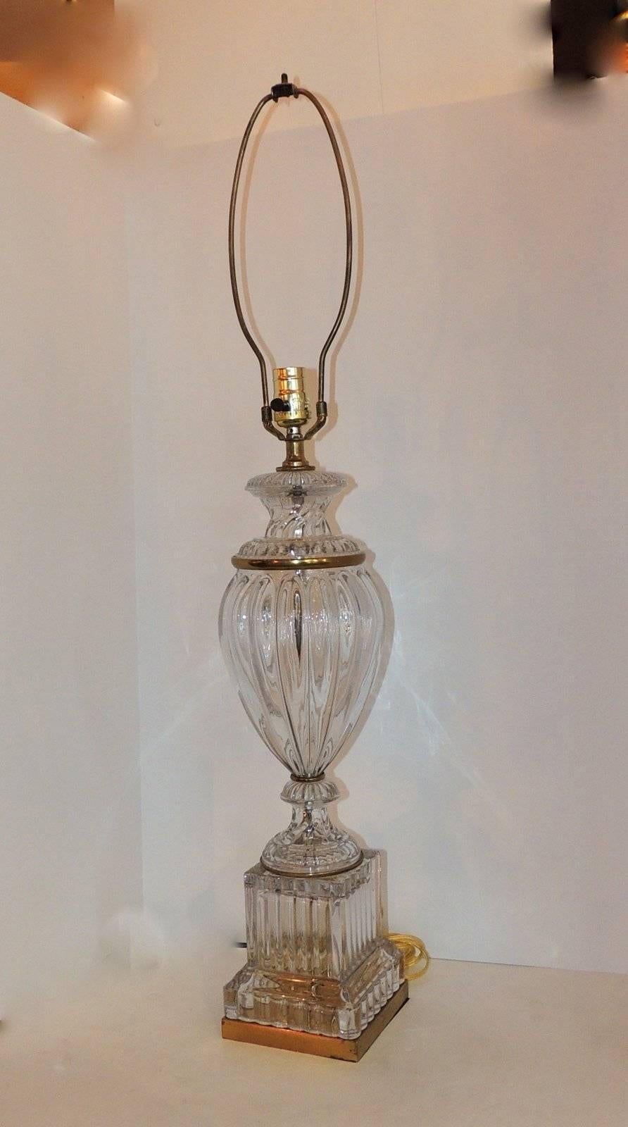 Beautiful fluted and cut crystal glass highlights this large pair of lamps with Ormolu details and pedestal.

Measures: 34" H x 5.5" base

Crystal center urn is 20"