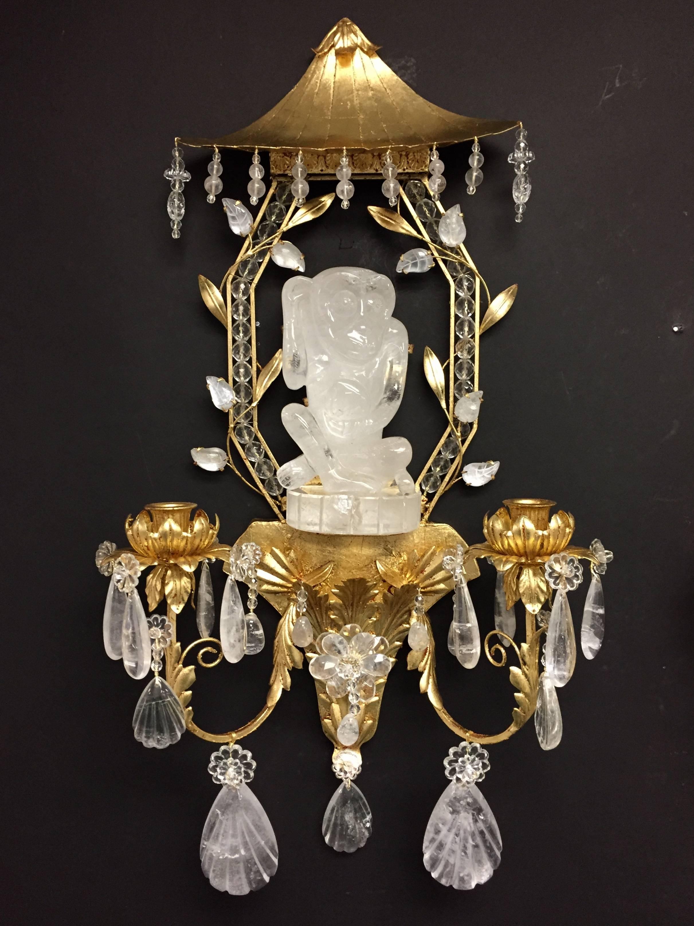 A wonderful rare large pair of rock crystal monkey gilt pagoda form two-arm sconces in the manner of Bagues & Jansen adorned with rock crystal drops throughout. 
 
Wiring is available for an additional charge of $250

Size: H 26", W